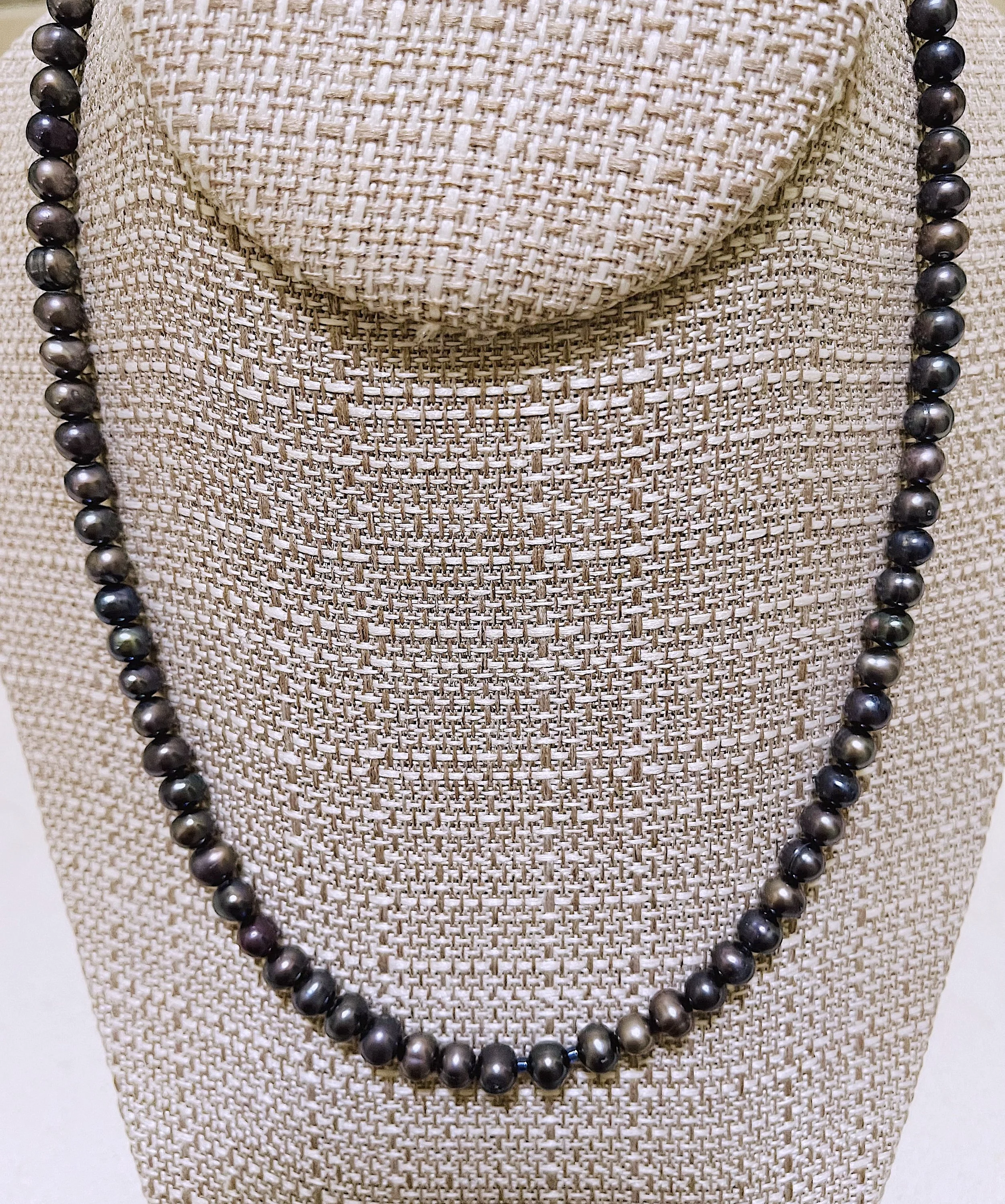 Peacock Pearls on stand.jpg
