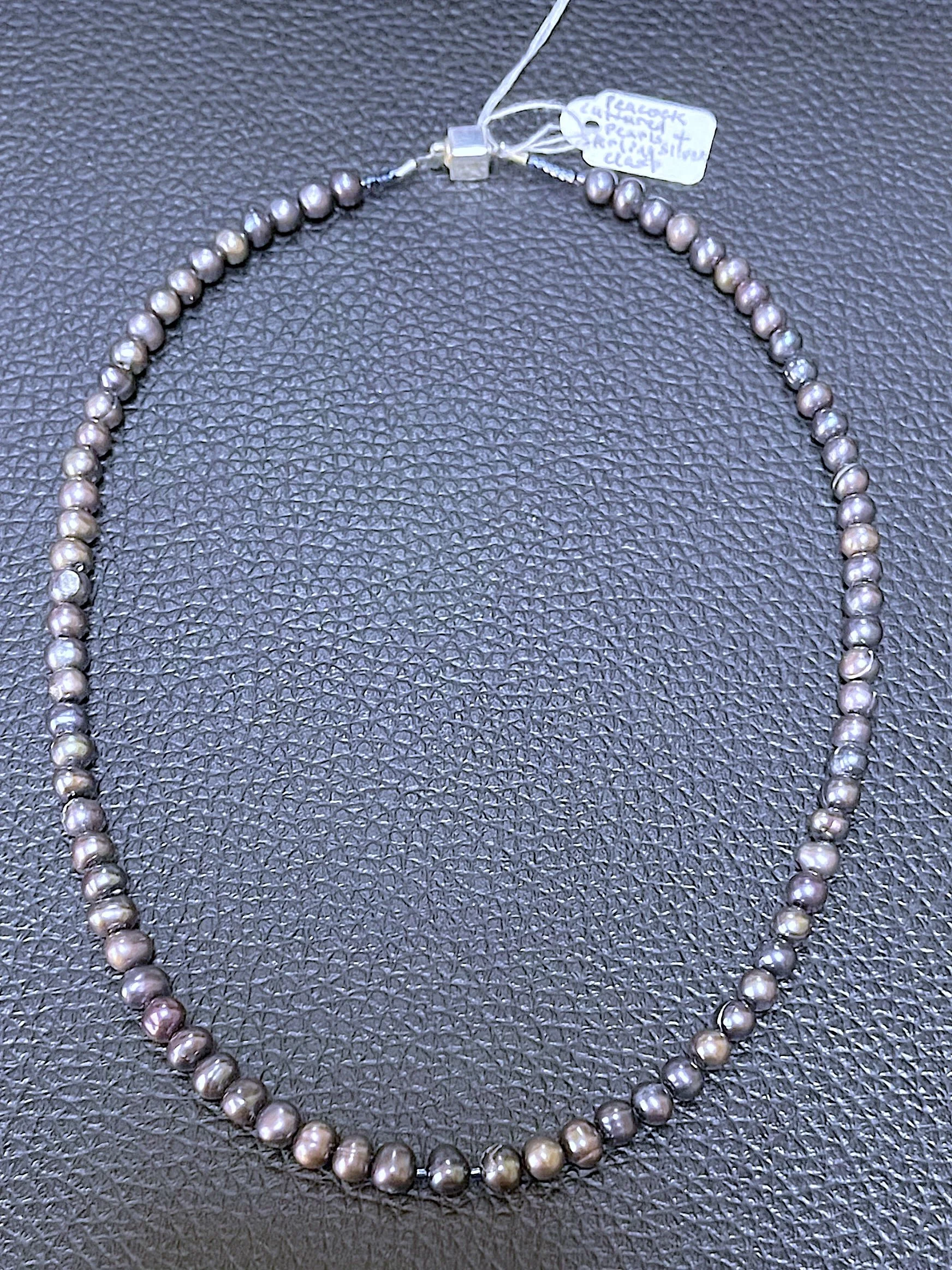 Peacock Pearls on black.jpg