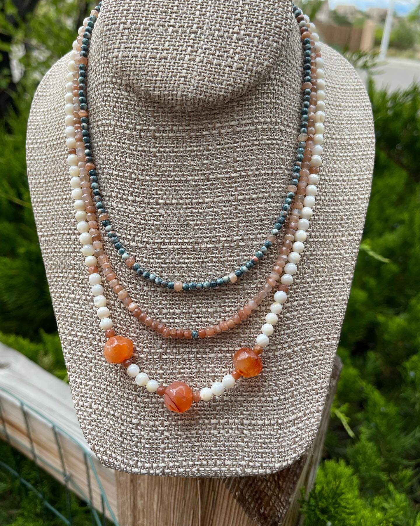 Summer Hues is my newest 3 strand necklace. I used orange Sodalite, Mother of Pearl rounds, 3 large Carnelian beads and faceted Peach Moonstone. It&rsquo;s completed with a silver filled toggle clasp. The short strand is 15 3/4&rdquo; and the longest