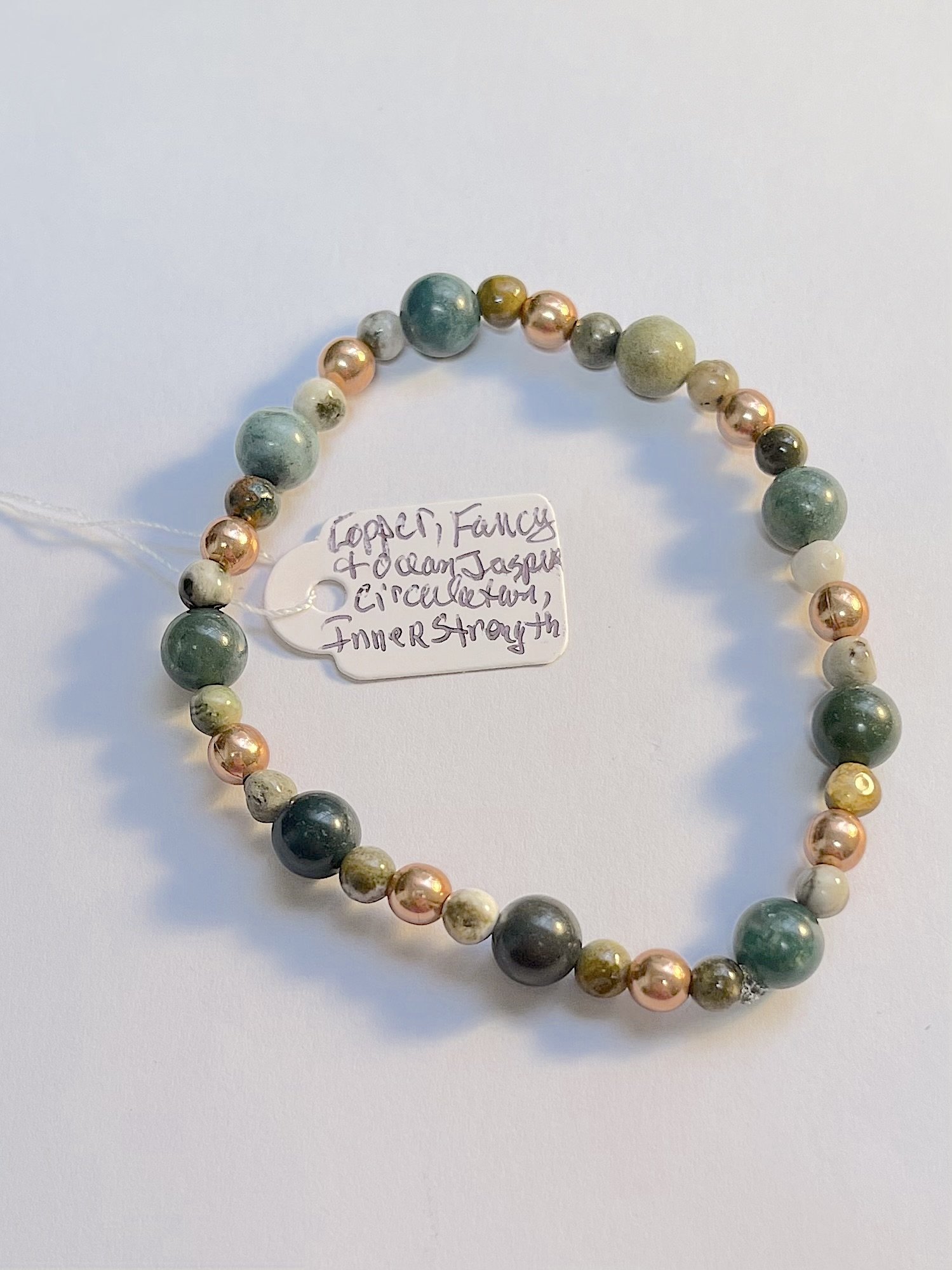 Copper,Fancy and Ocean Jasper energy bracelet with tag.jpg