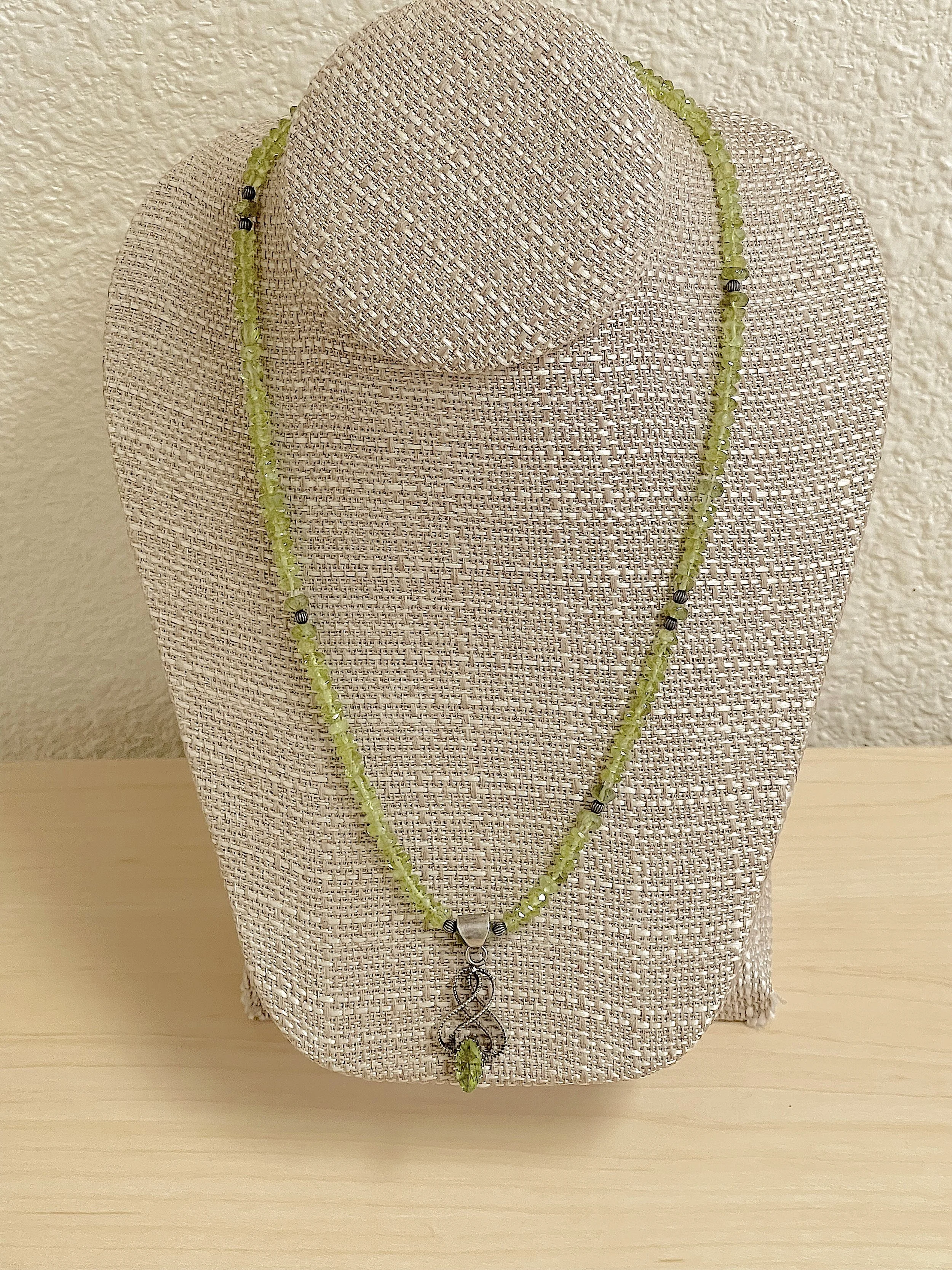 Peridot single on stand inside.jpg