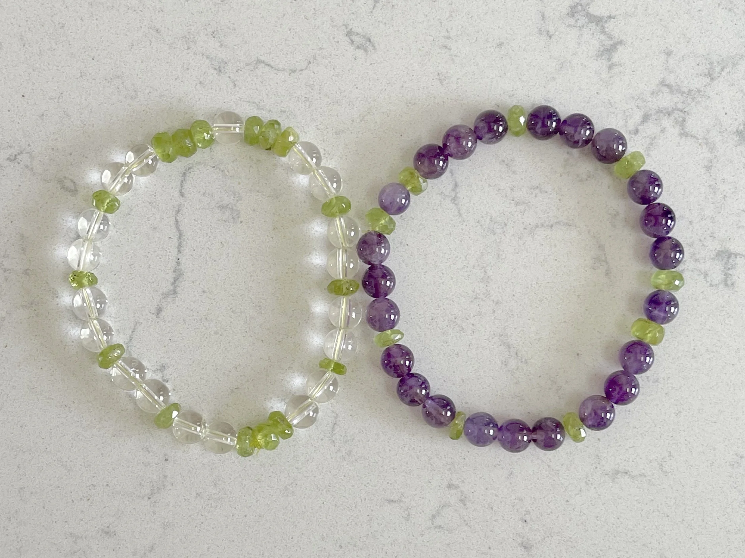 Peridot and Quartz and Amethyst and Peridot energy bracelets.jpg