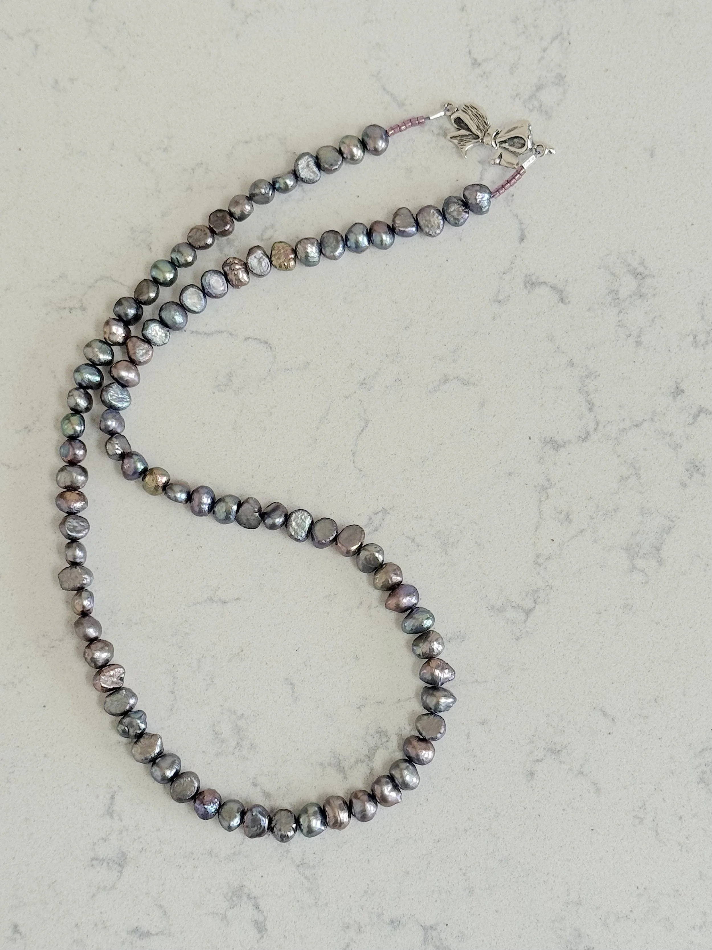 Silver Peacock pearls curved:good.jpg