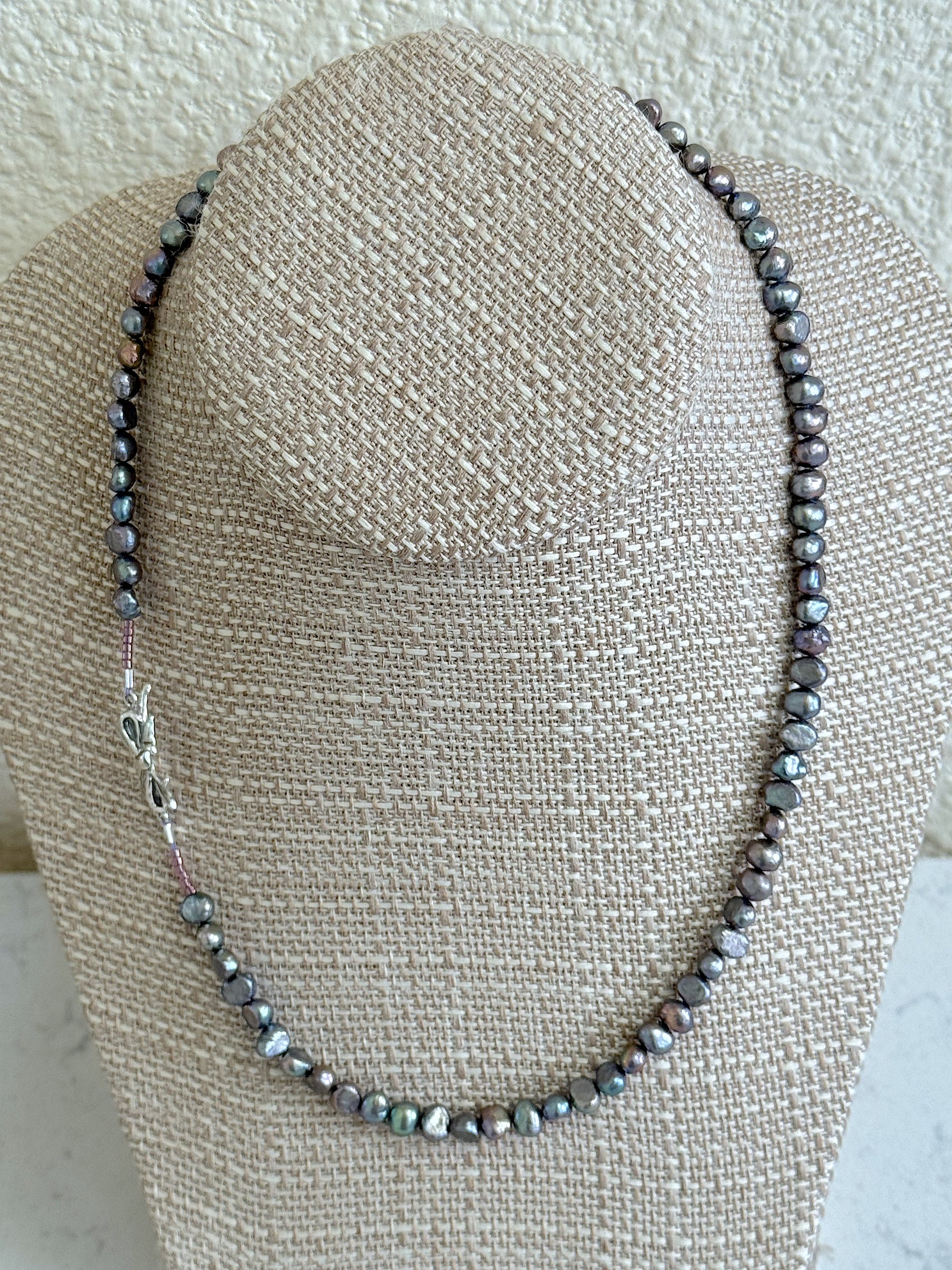 Silver Peacock pearls with bow clasp.jpg