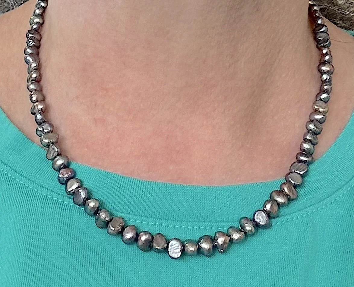 Silver Peacock pearls on me.jpg