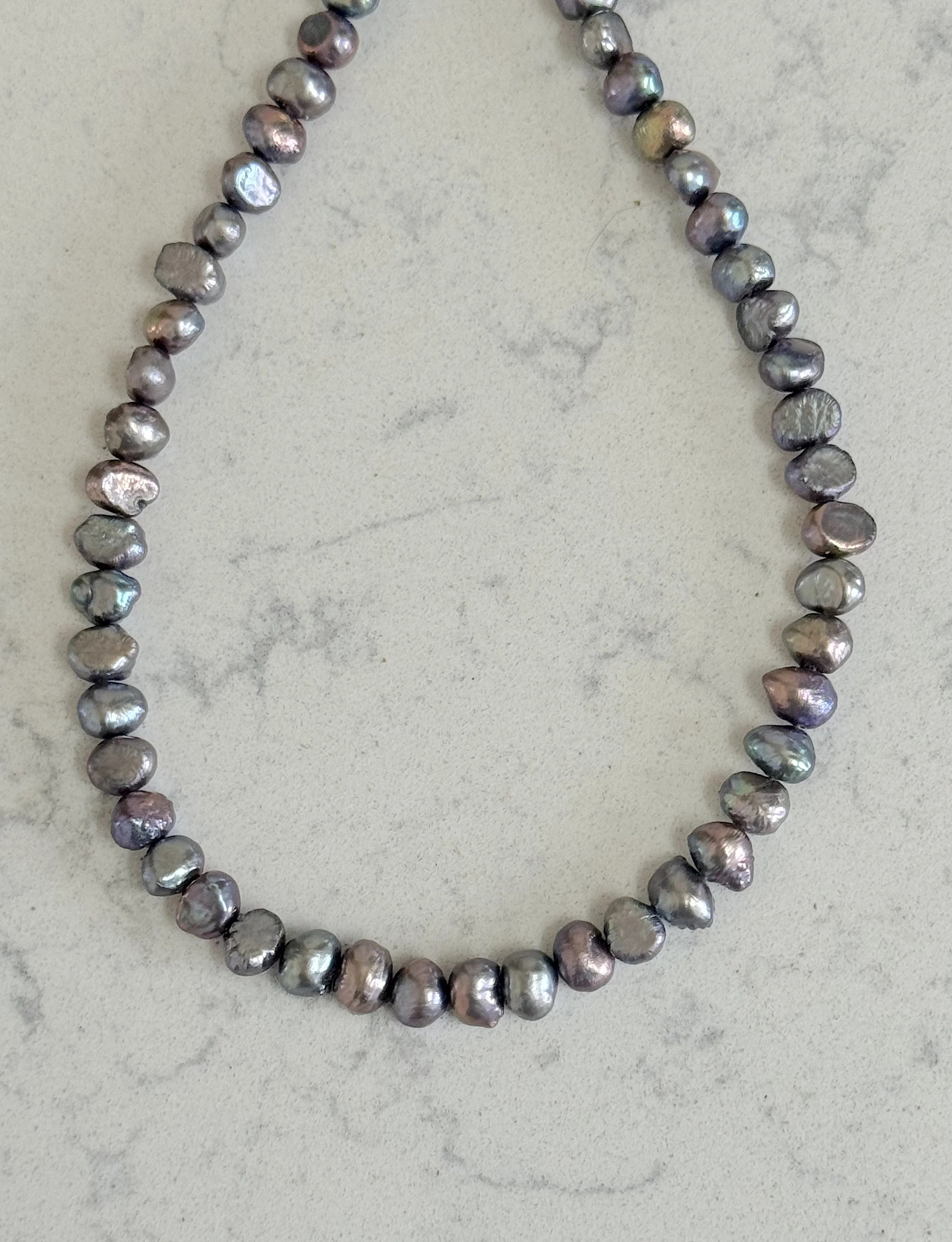 Silver Peacock pearls closeup.jpg