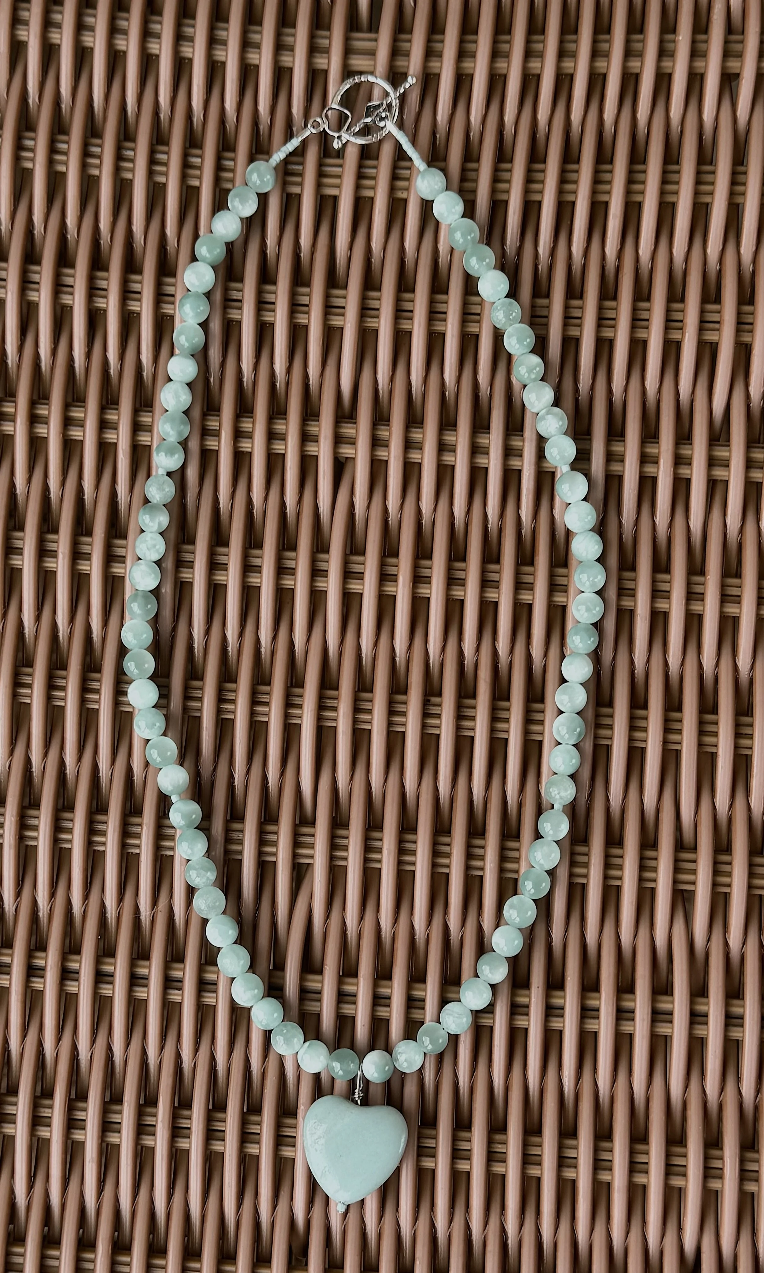 Amazonite heart with Angelite wicker table.jpg