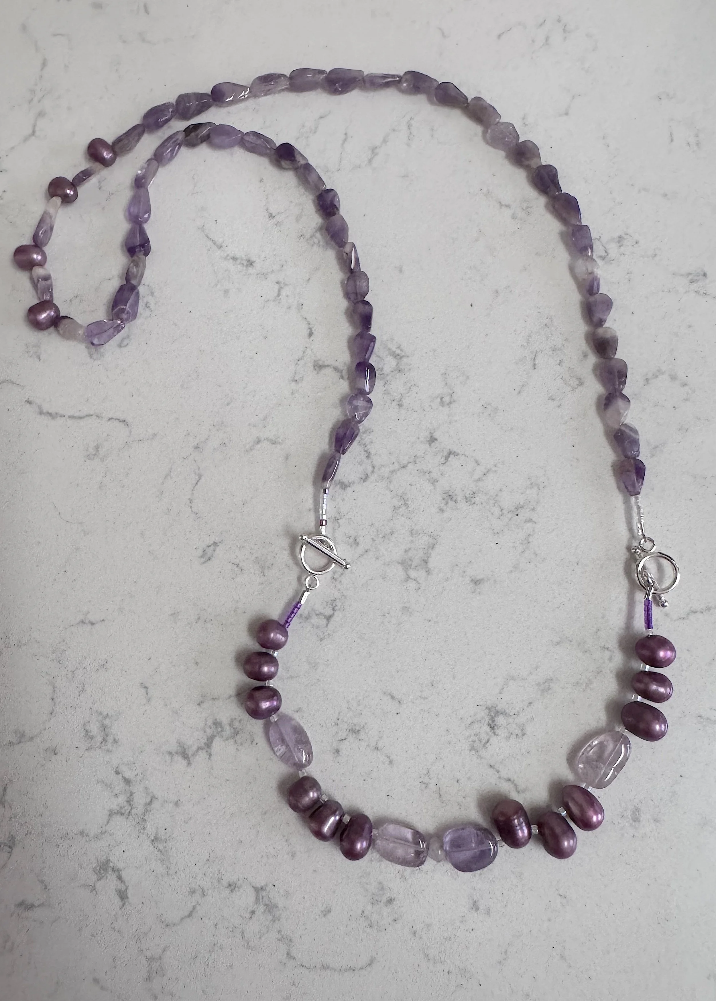 Purple Flowers with bracelet 2 attached.jpeg