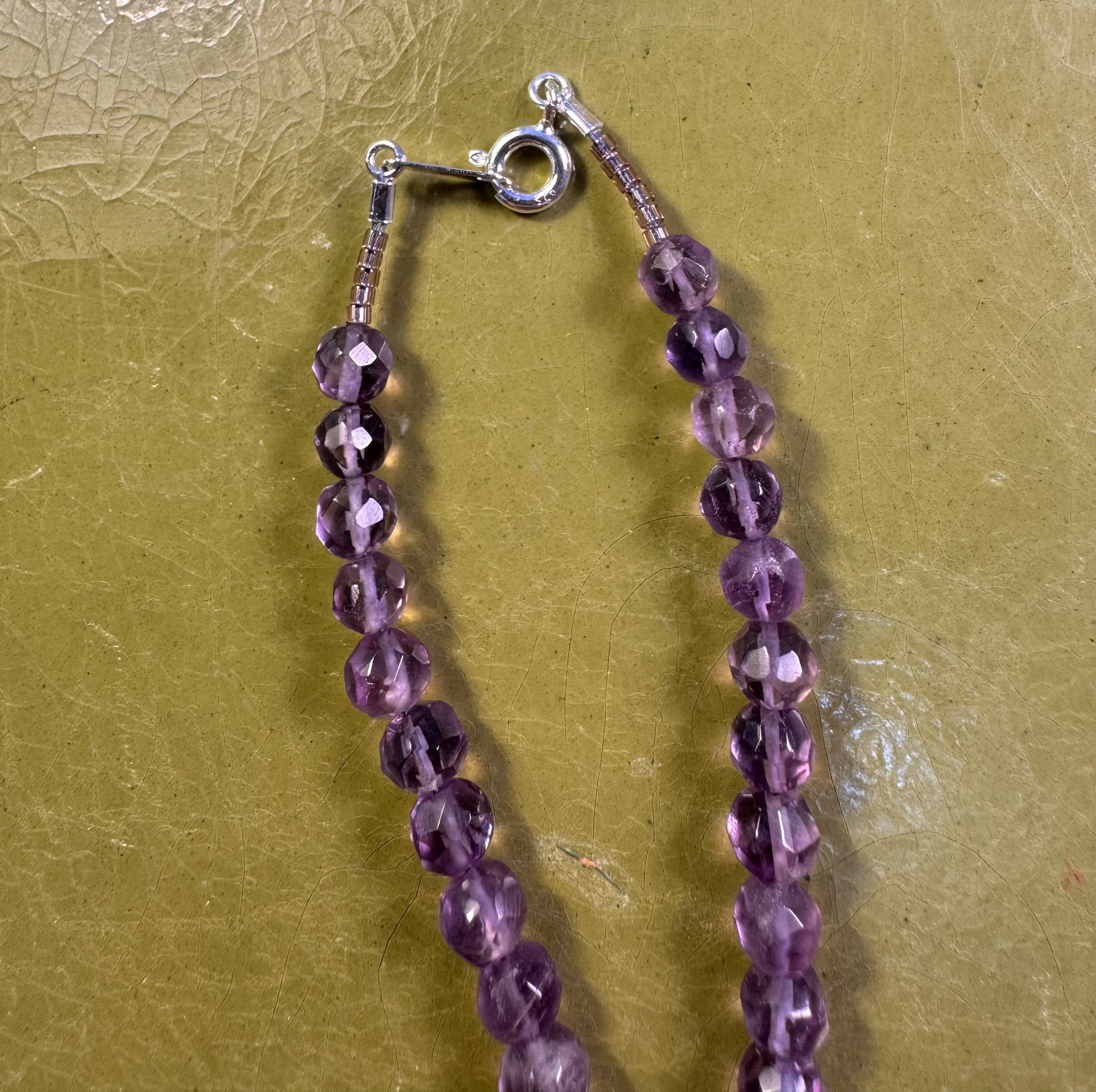 Round Faceted Amethyst clasp.jpeg
