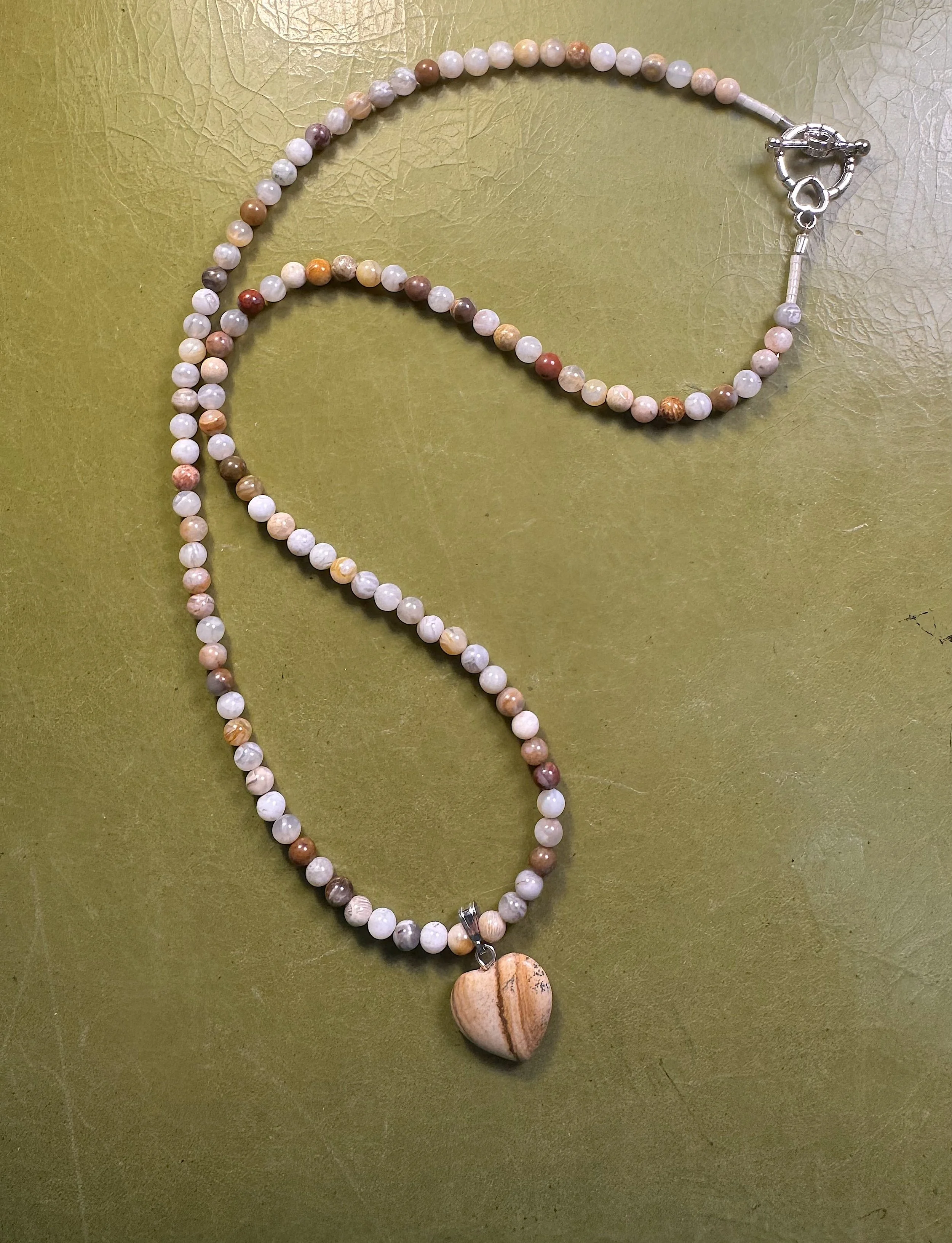Bamboo Agate and Picture Jasper heart curved.jpeg