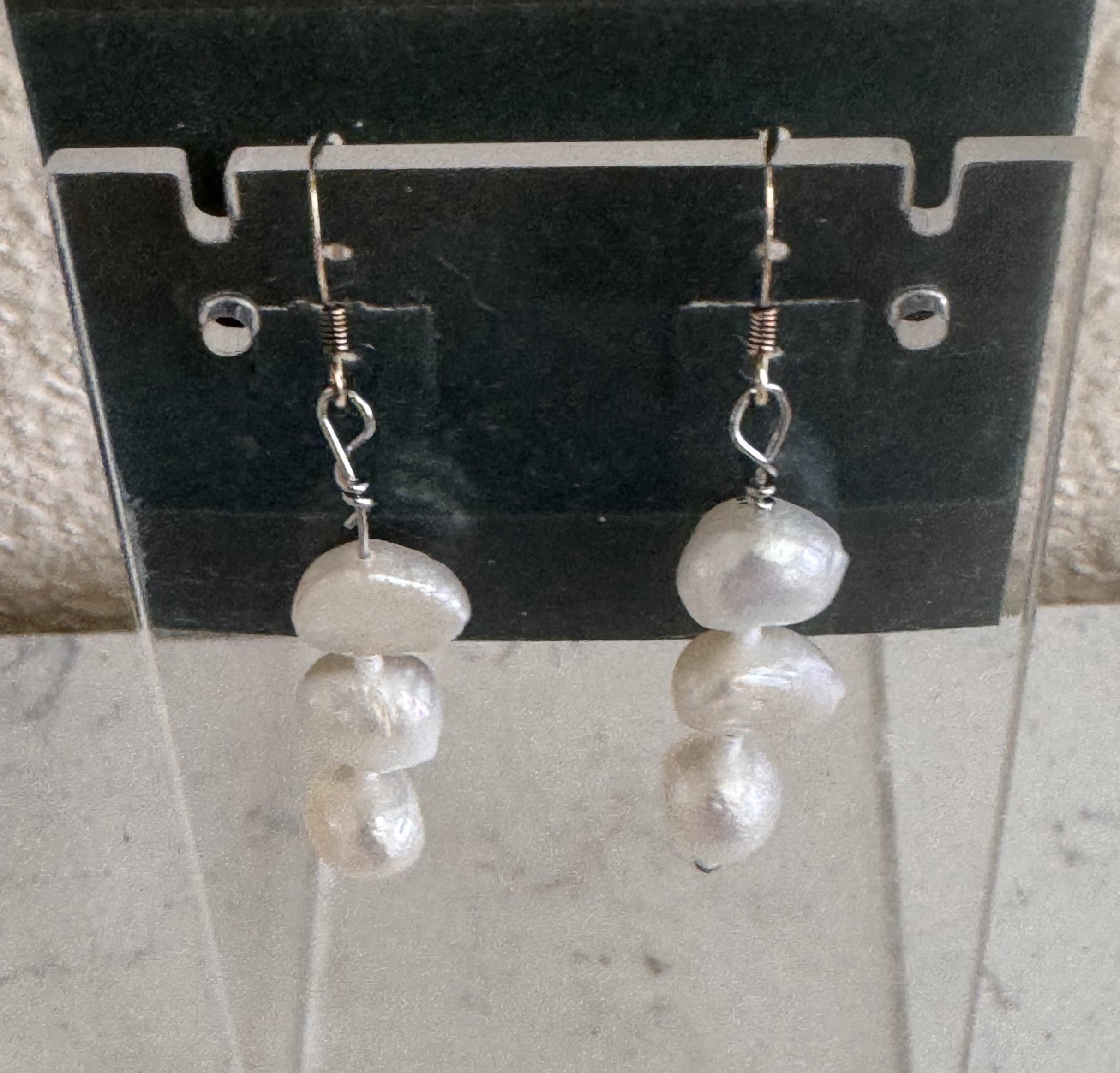 Potato Cultured Pearl earrings on stand.jpeg