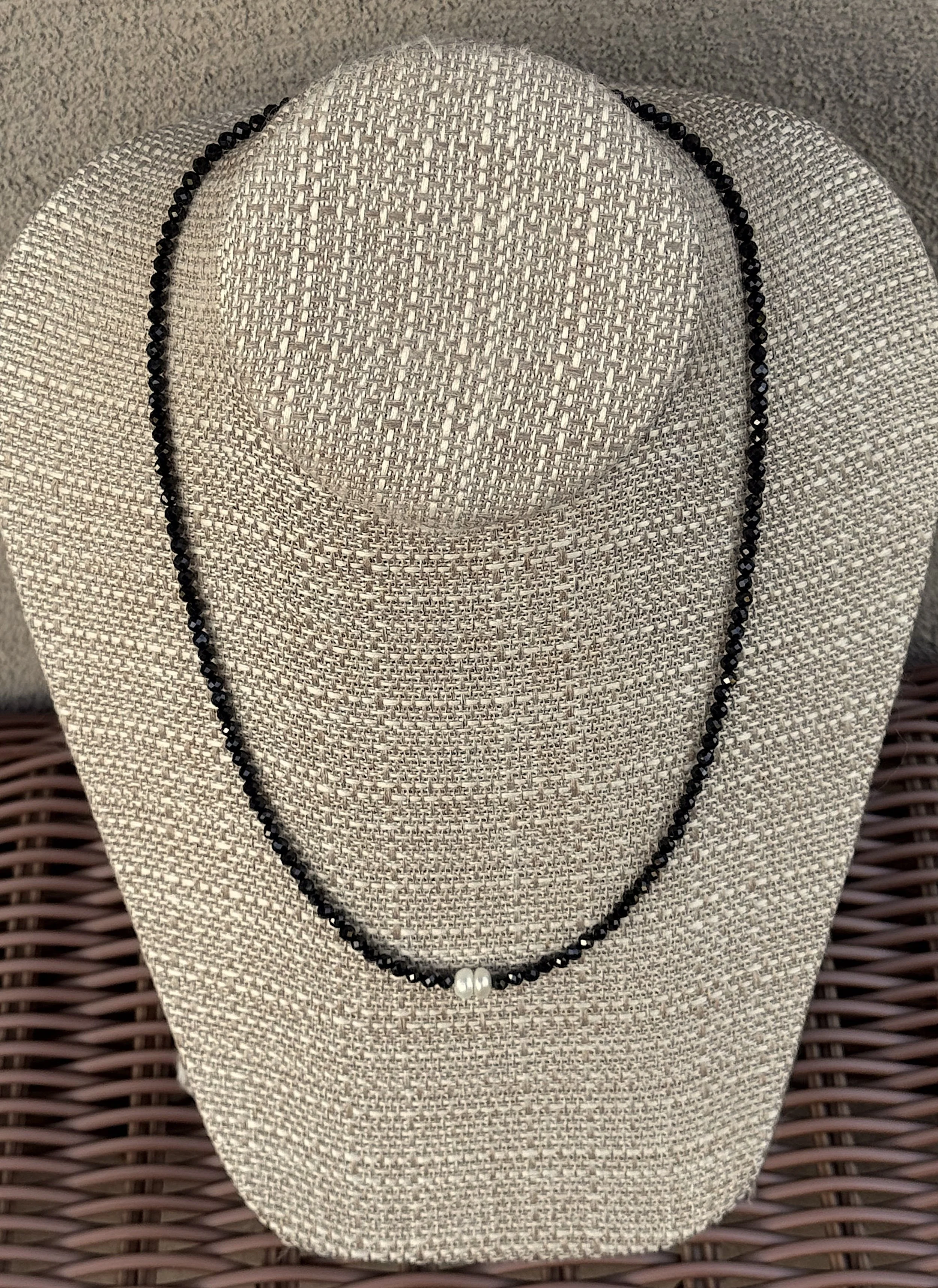 Two Pearls-Faceted Blck Spinel wicker table.jpeg