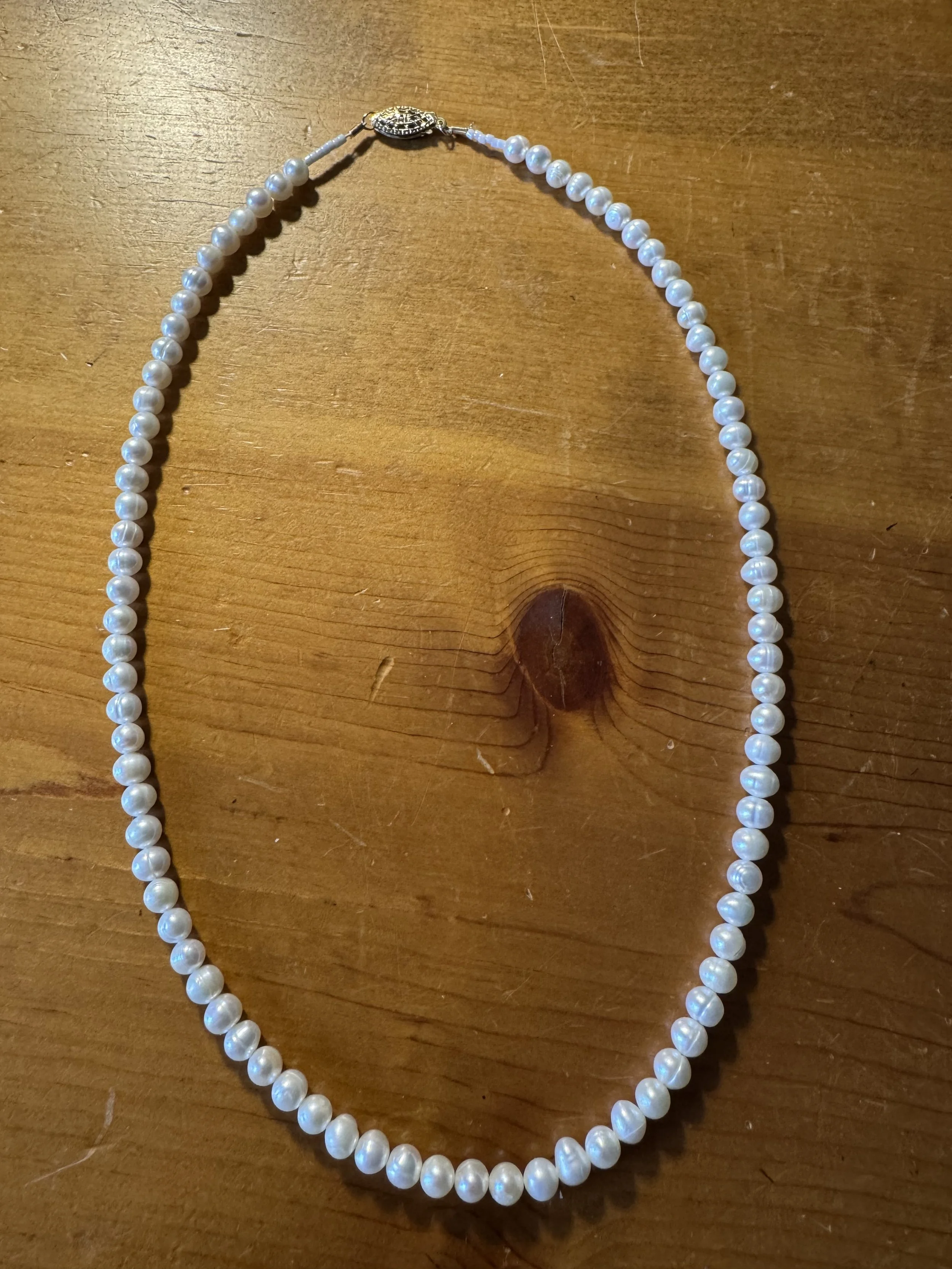 Cultured white pearls with gold clasp better.jpg
