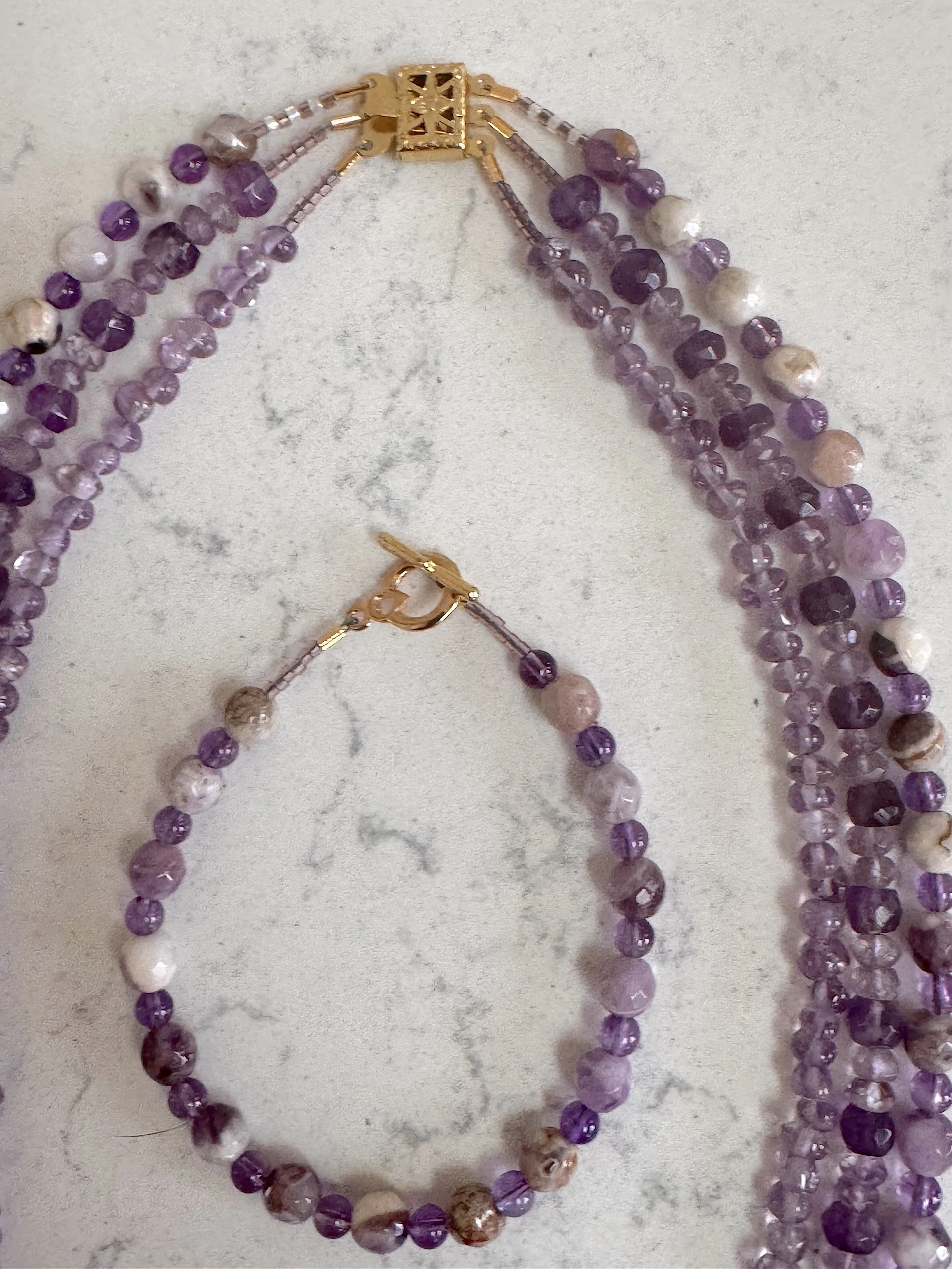 Lavender Amethyst set on quartz close.jpeg