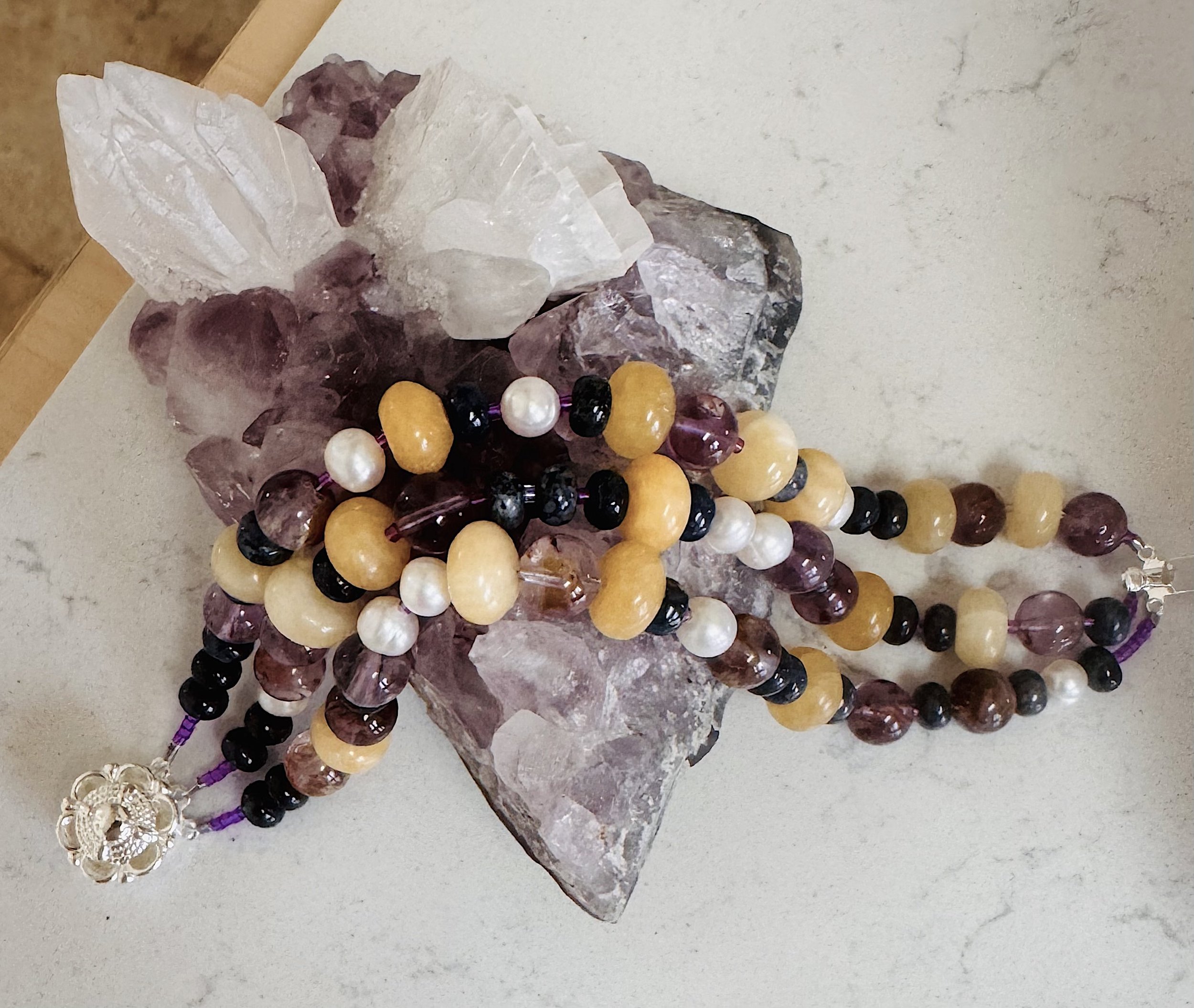 Glass Gem Corn bracelet on amethyst.jpeg