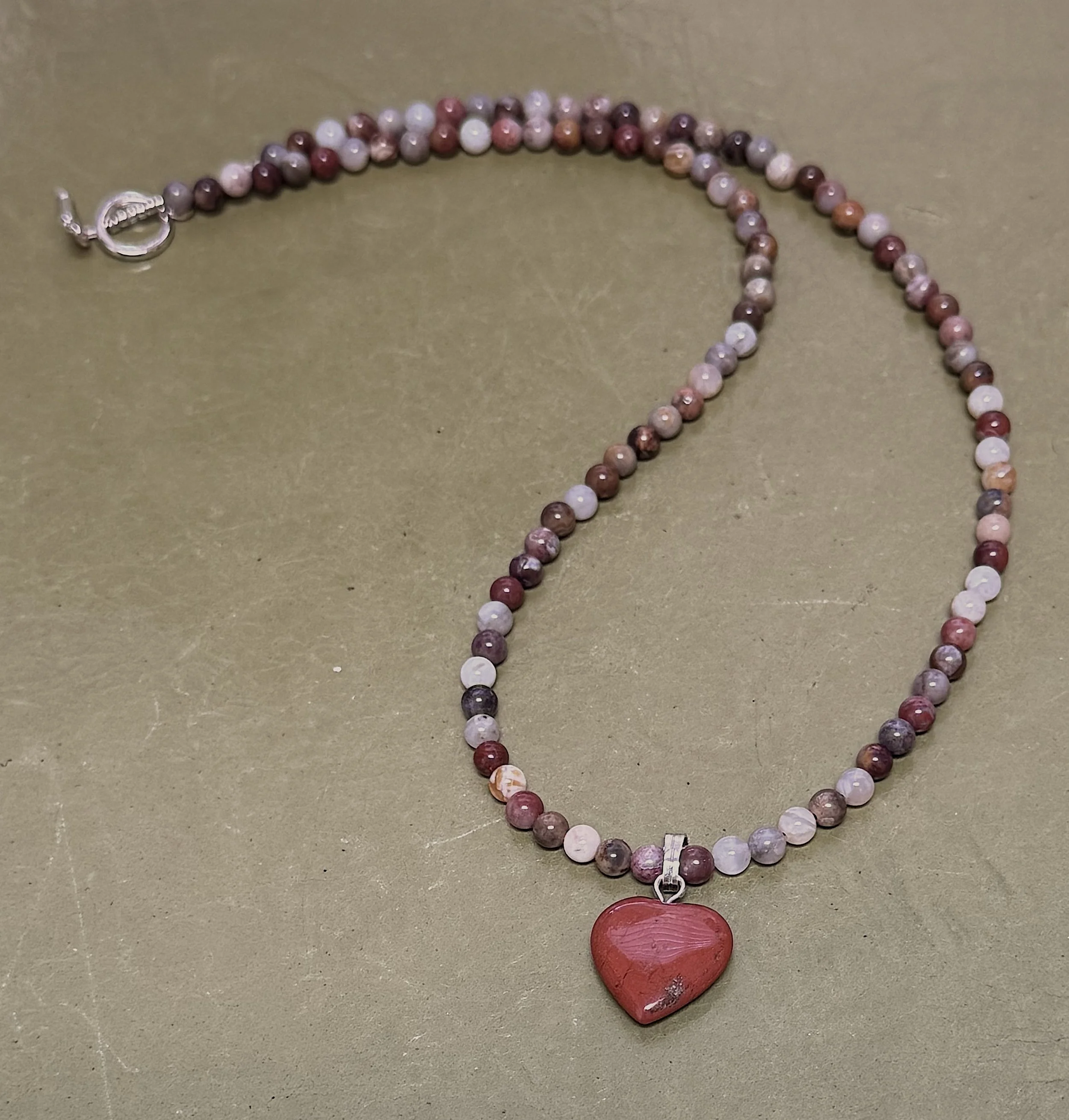 Bamboo Agate and Red Jasper heart curved.jpeg