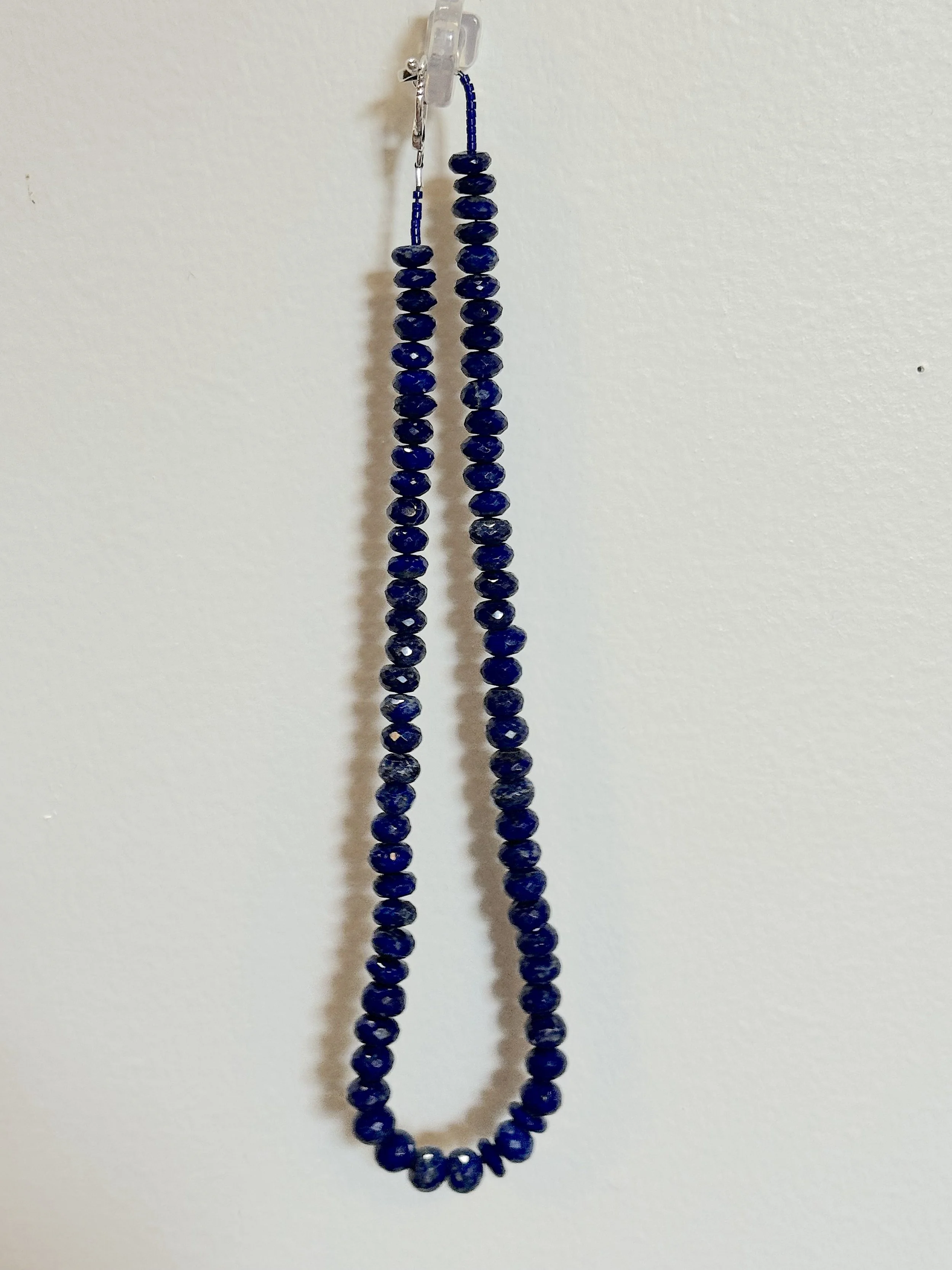 Lapis faceted rondelles hanging.jpg