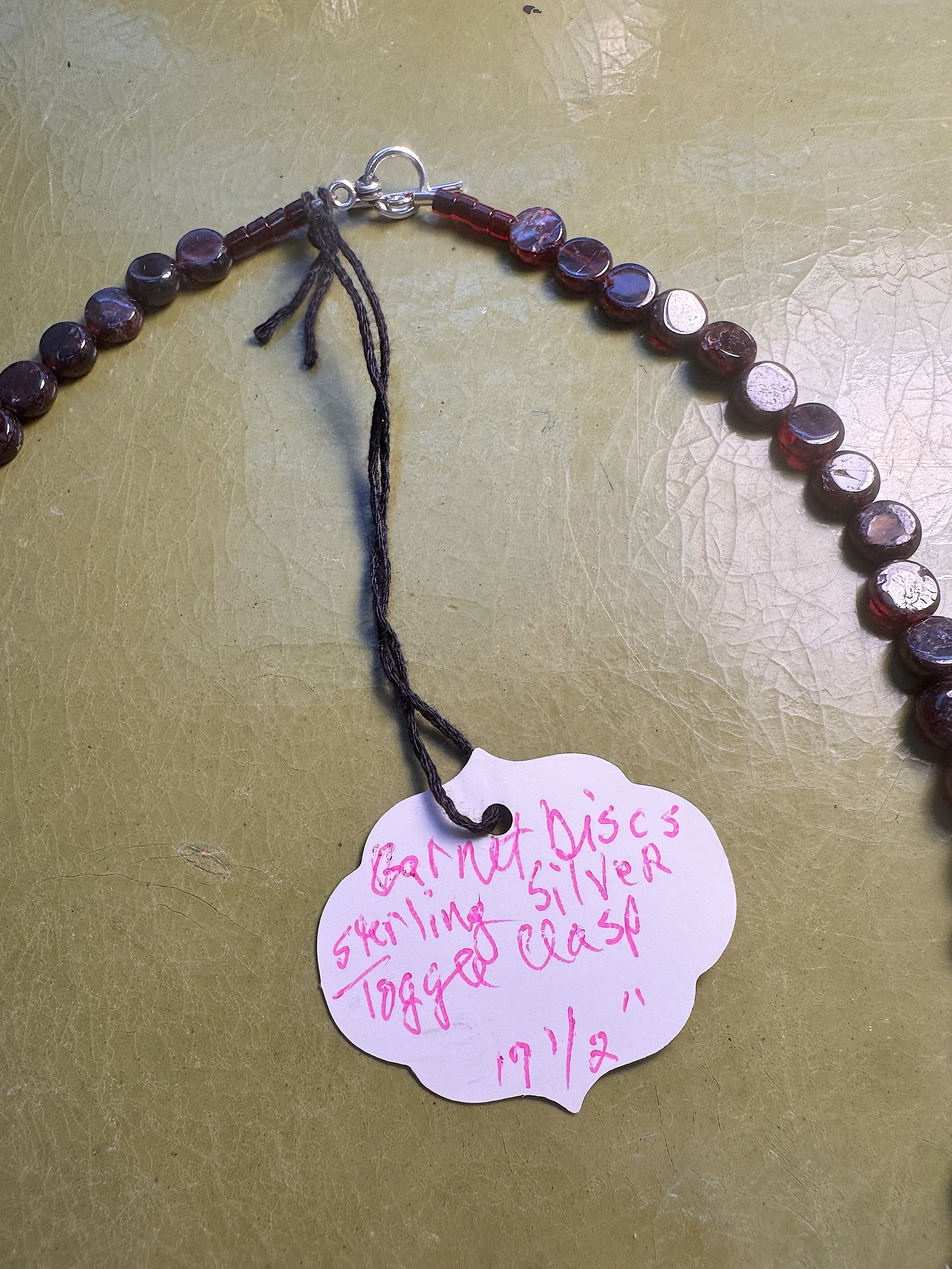 Garnet discs clasp ane tag.jpeg