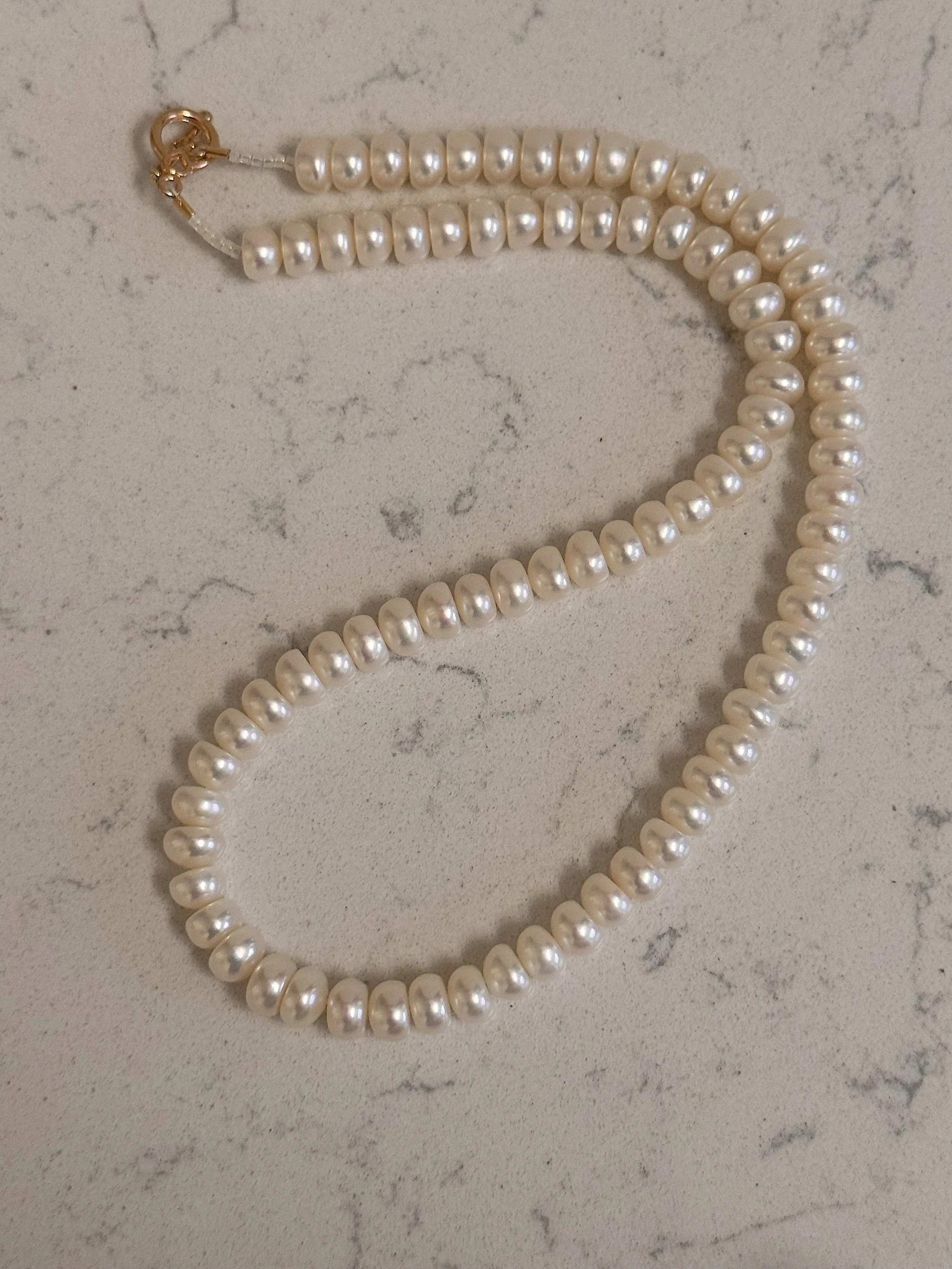 New Button Pearls curved on quartz.jpeg
