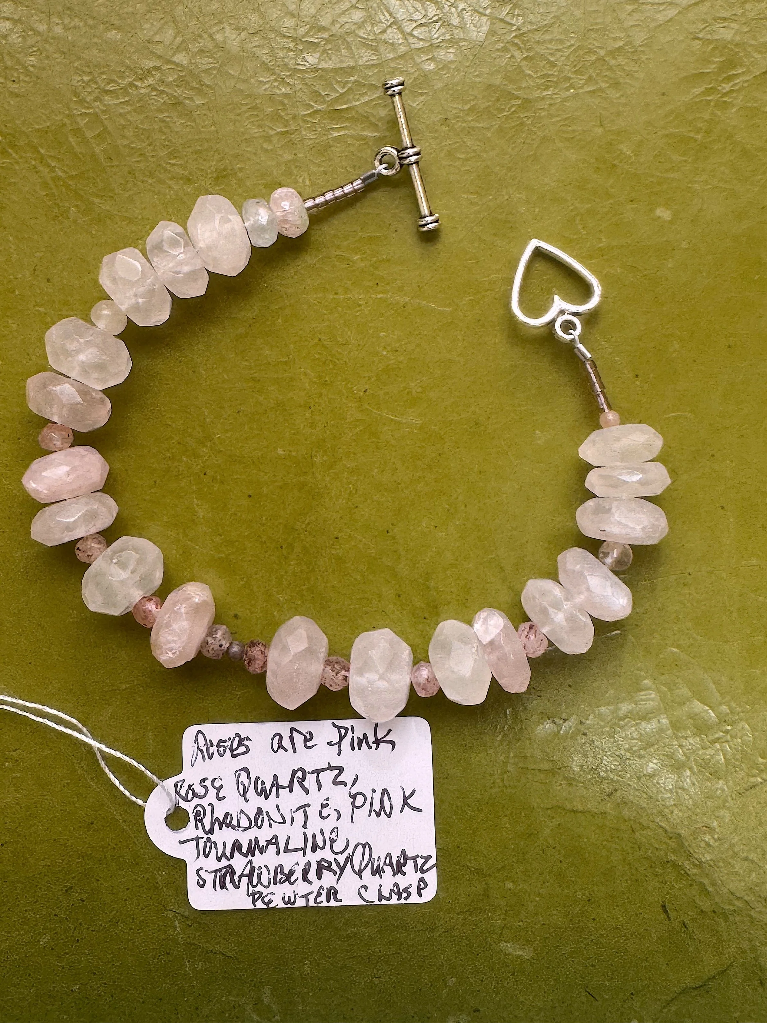 Roses Are Pink bracelet info tag.jpeg