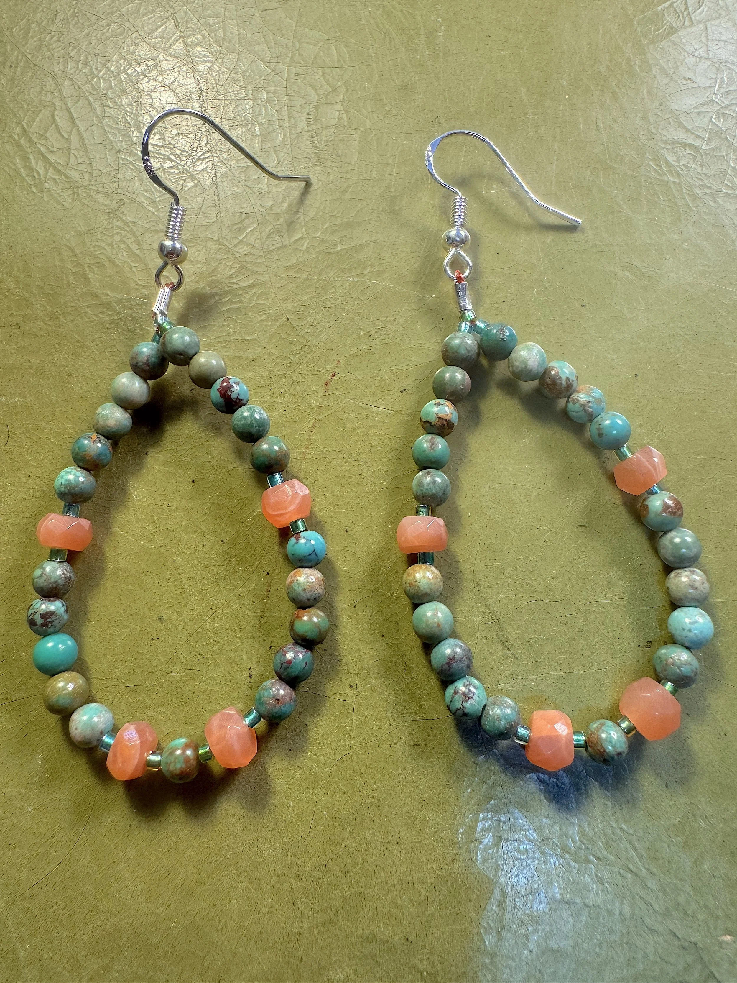 Turquoise and Rainbow Moonstone hoops on green.jpeg