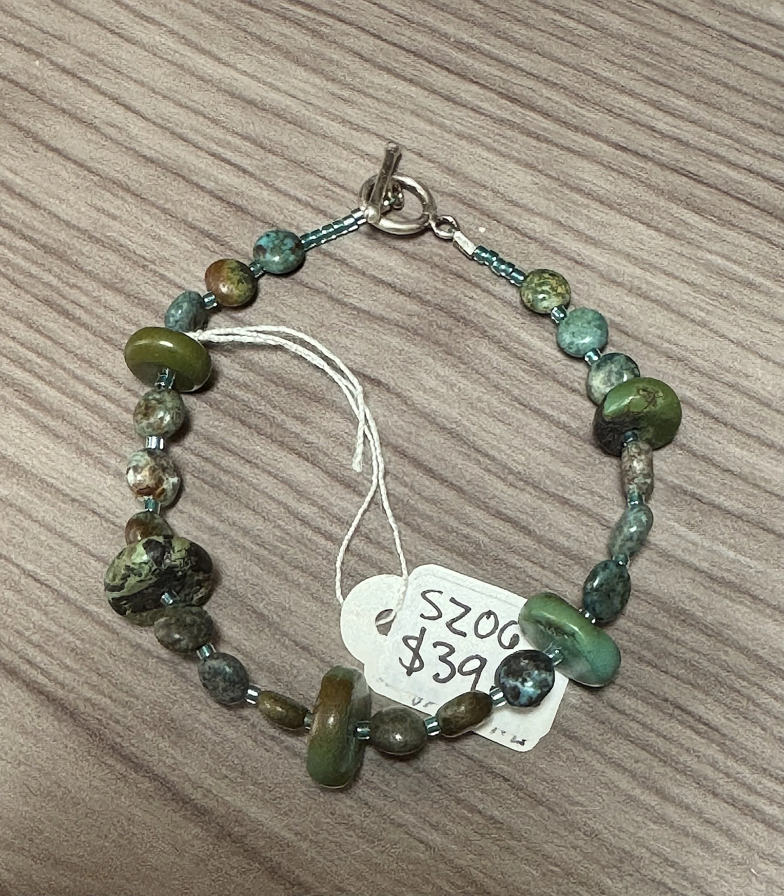 Turquoise coin and disc bracelet.jpeg