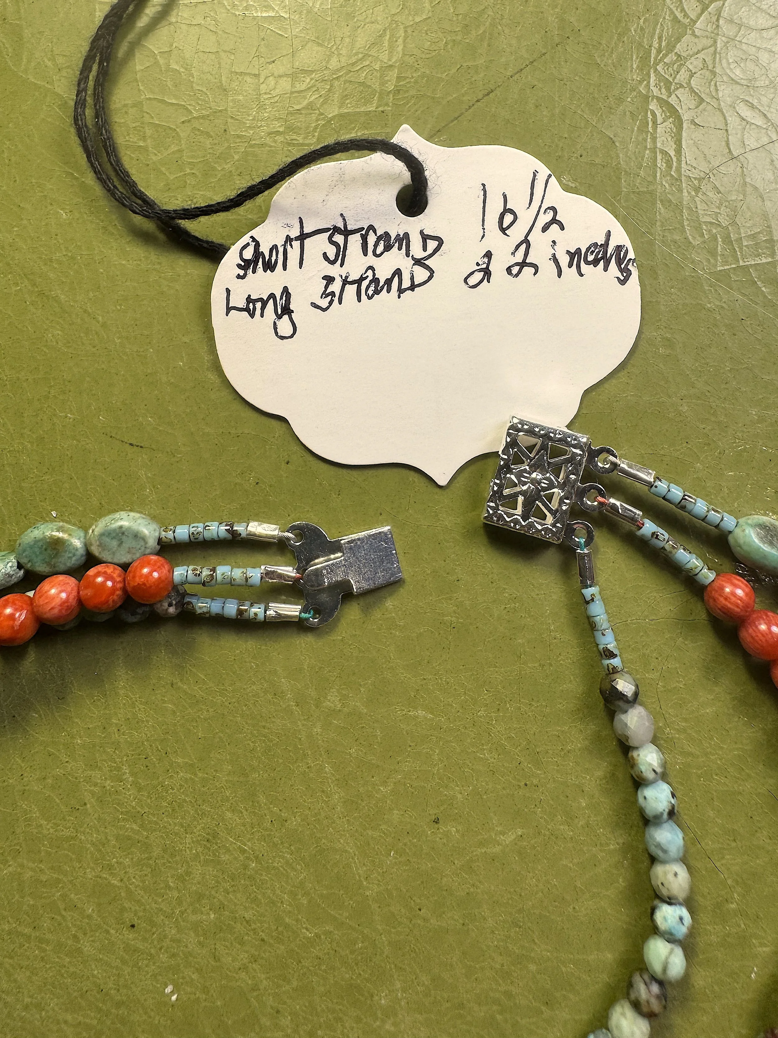 Feeling Western clasp open and info tag.jpeg