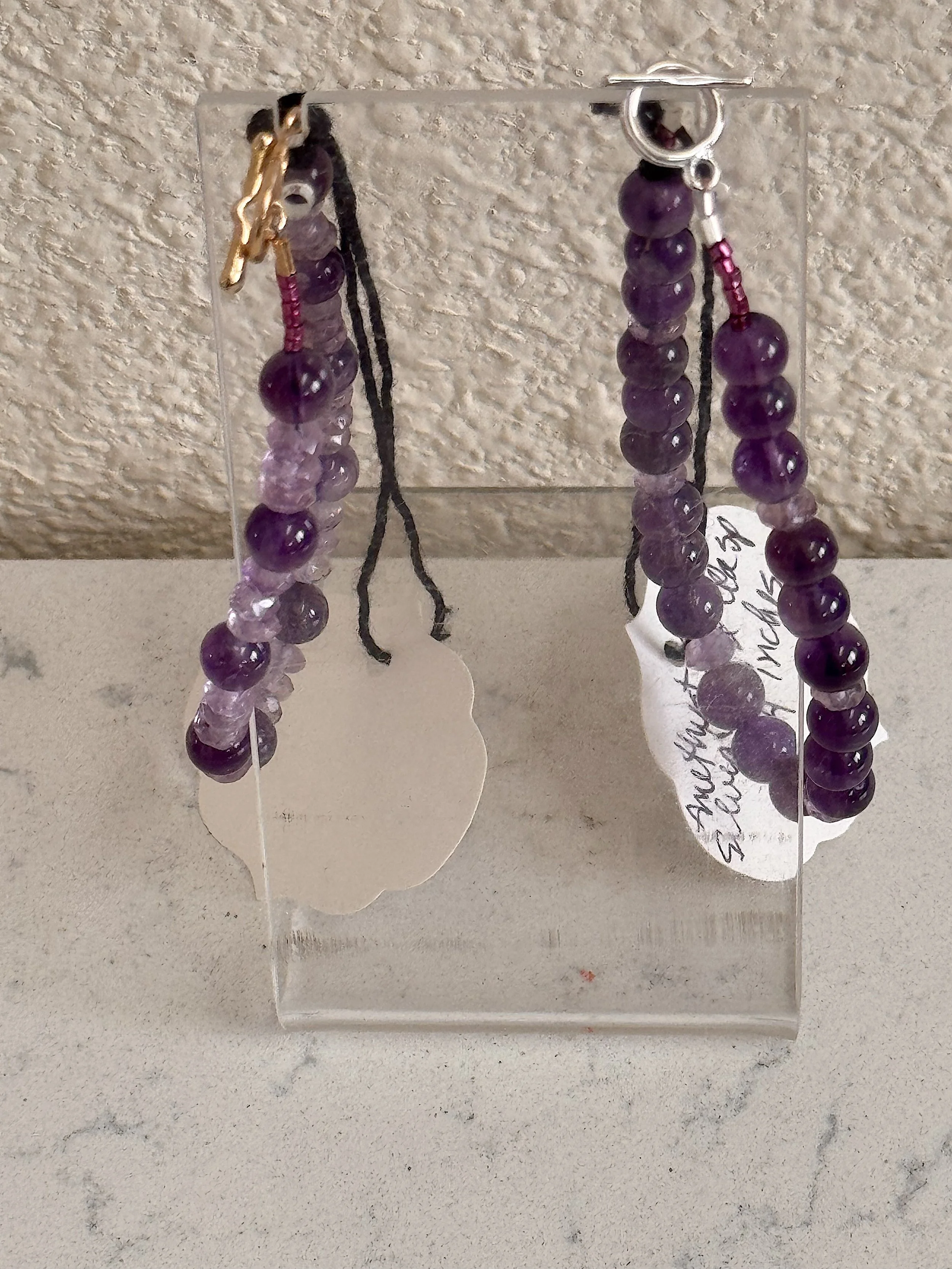 Amethyst Bracelets on earring stand.jpeg
