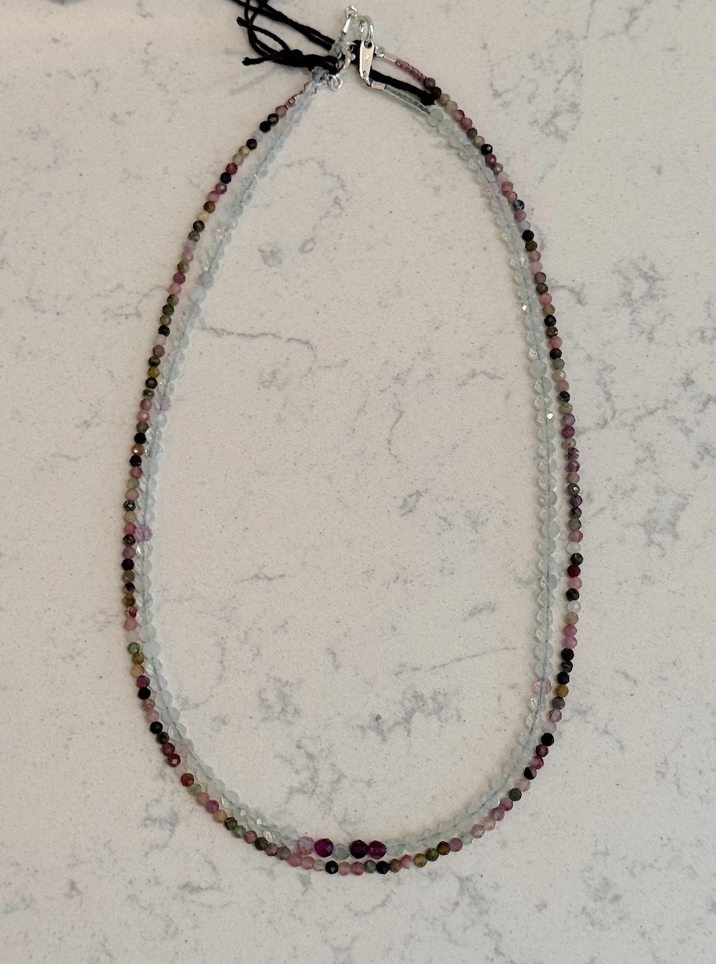 Tiny Tourmallie and Faceted Fluorite.jpeg