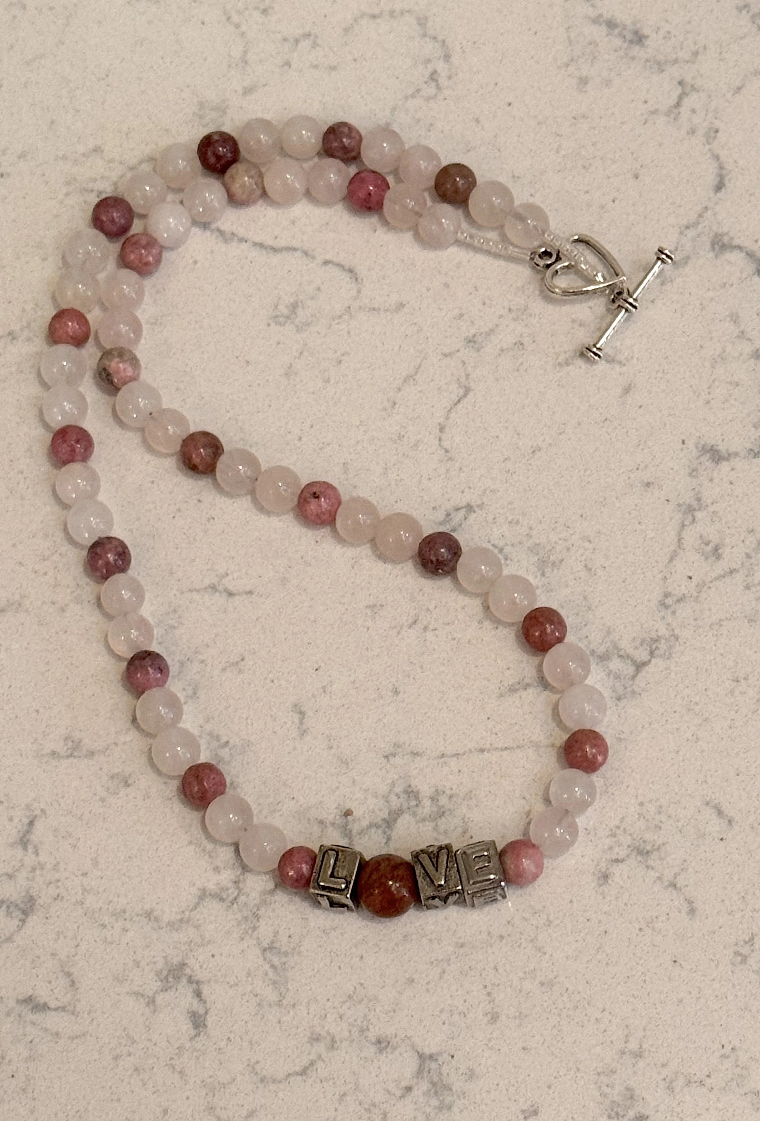 Loveuary necklace curved.jpeg