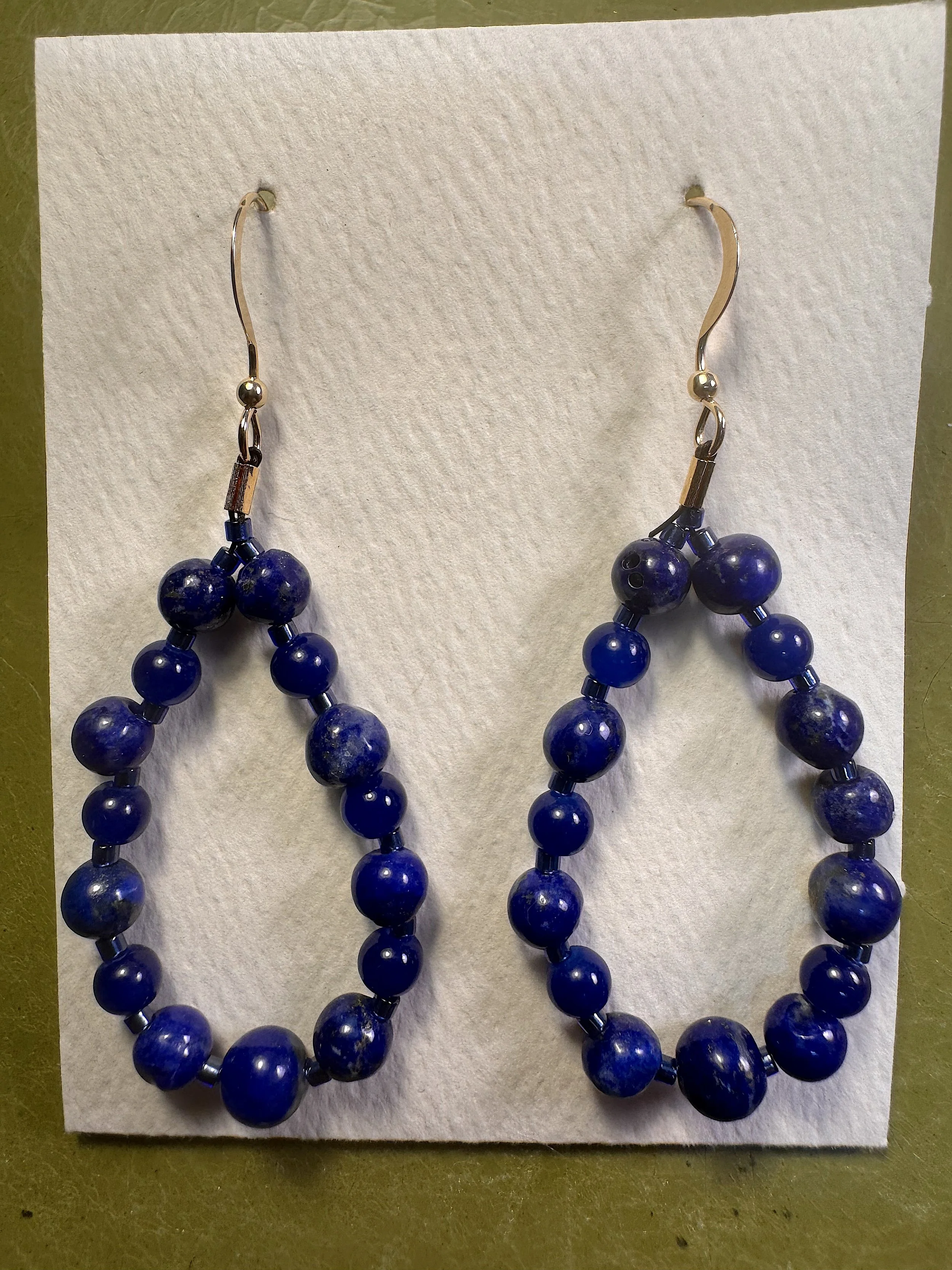 Lapis large hoops on stand.jpeg
