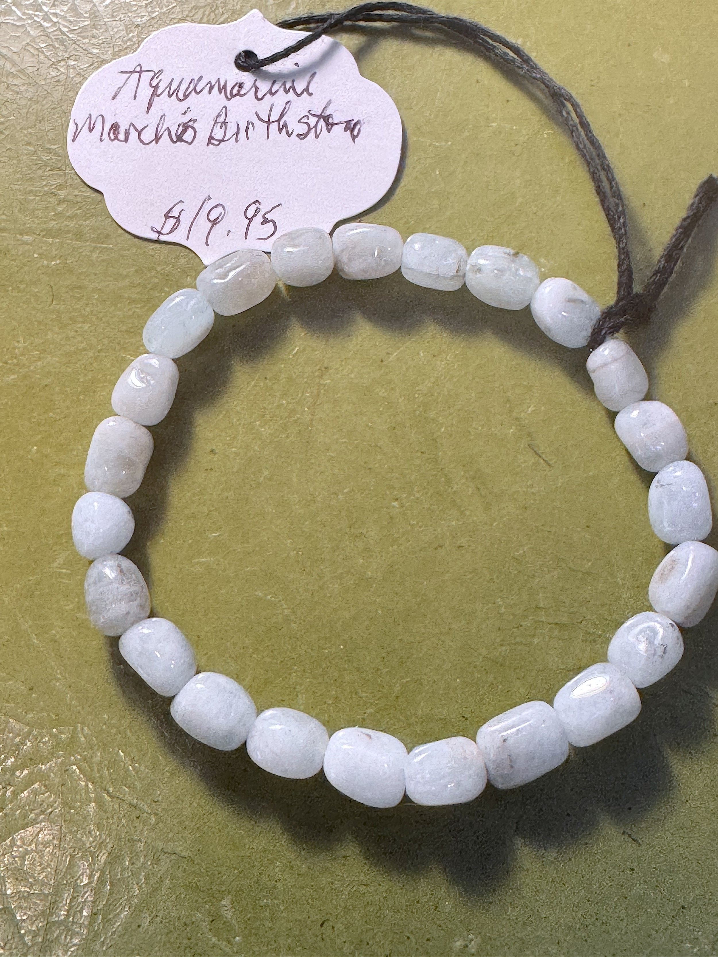 Aquamarine bracelet with tag.jpeg