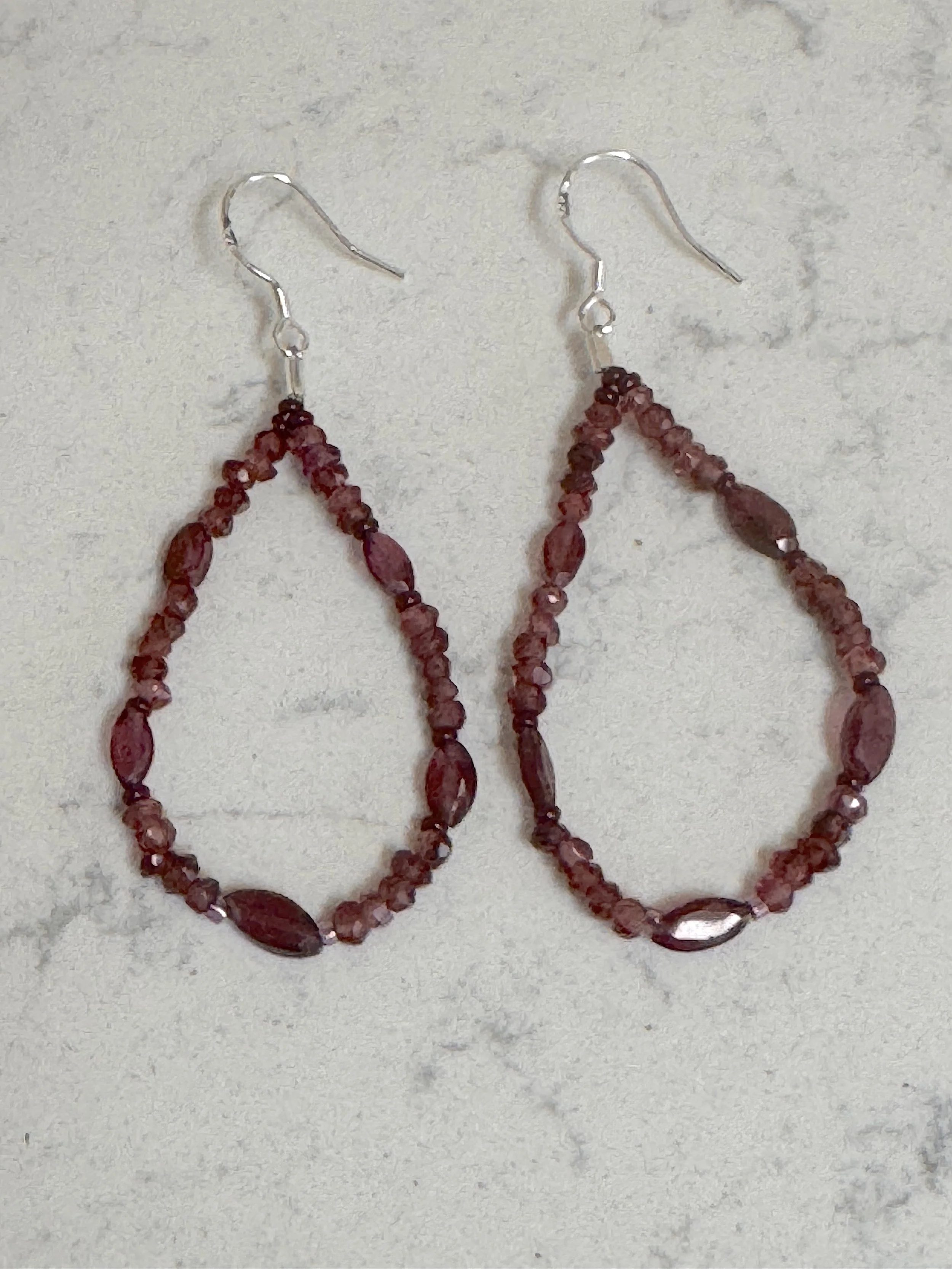 Garnet hoops on quartz.jpeg