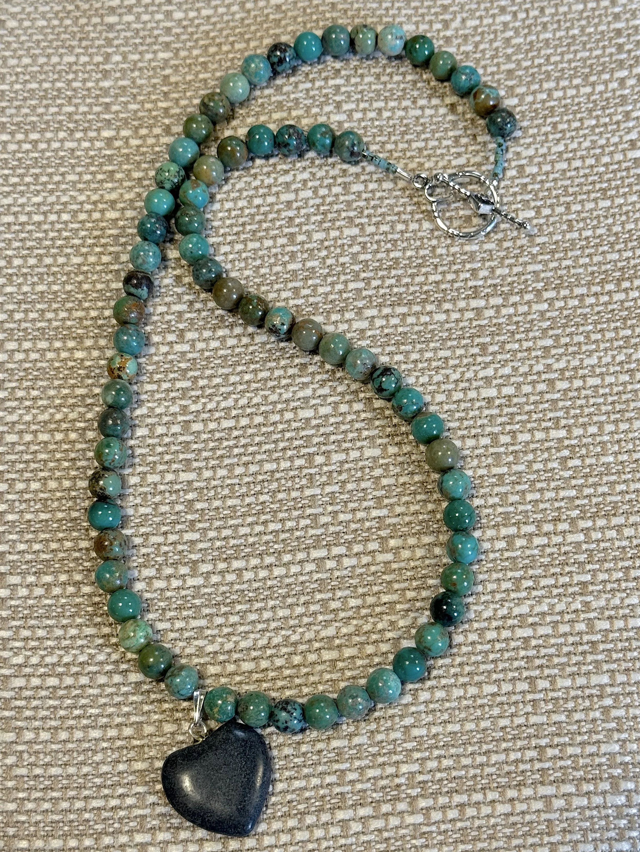Chrysocolla heart necklace curved.jpg