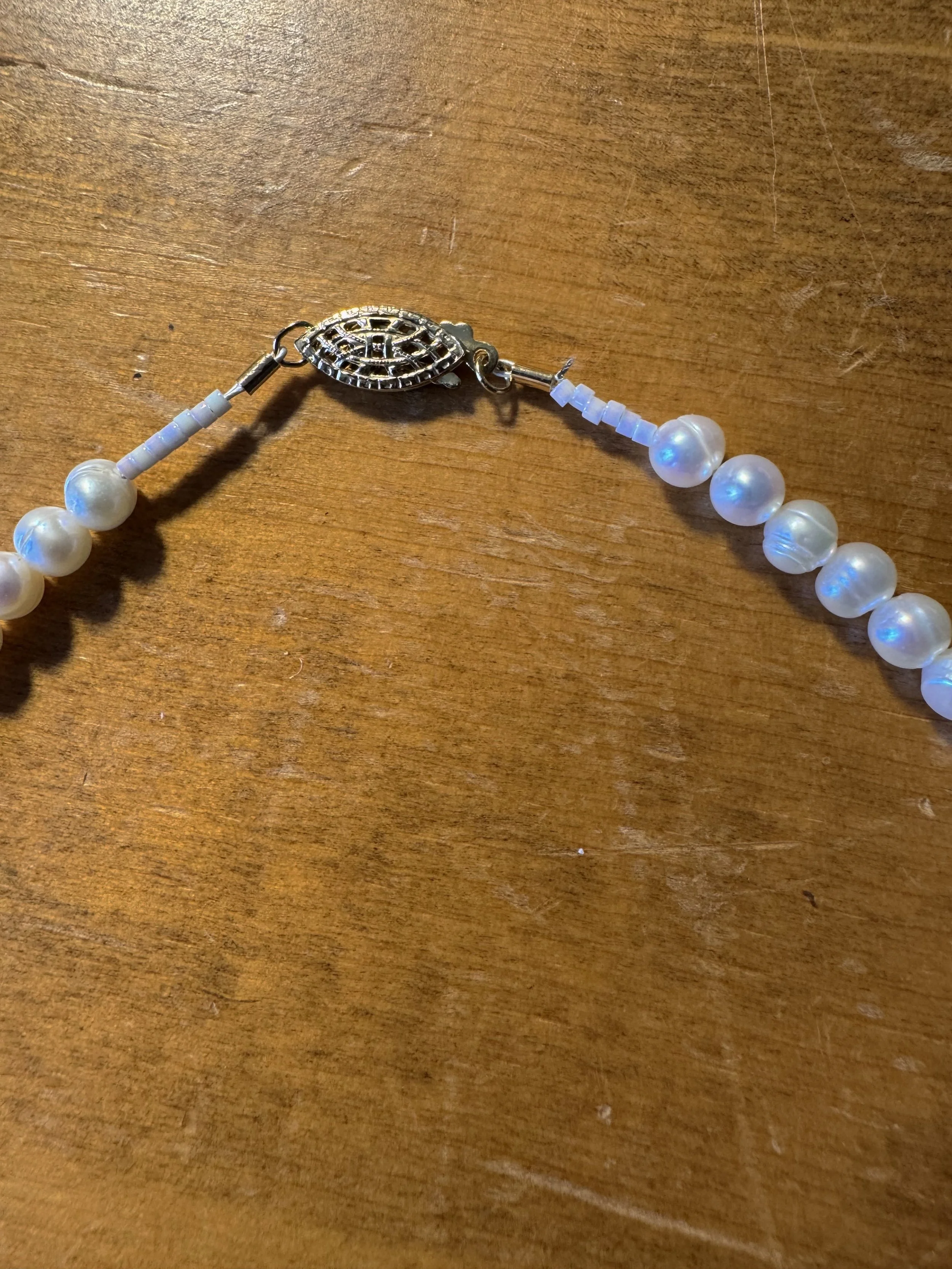 Cultured white pearls gold clasp.jpg