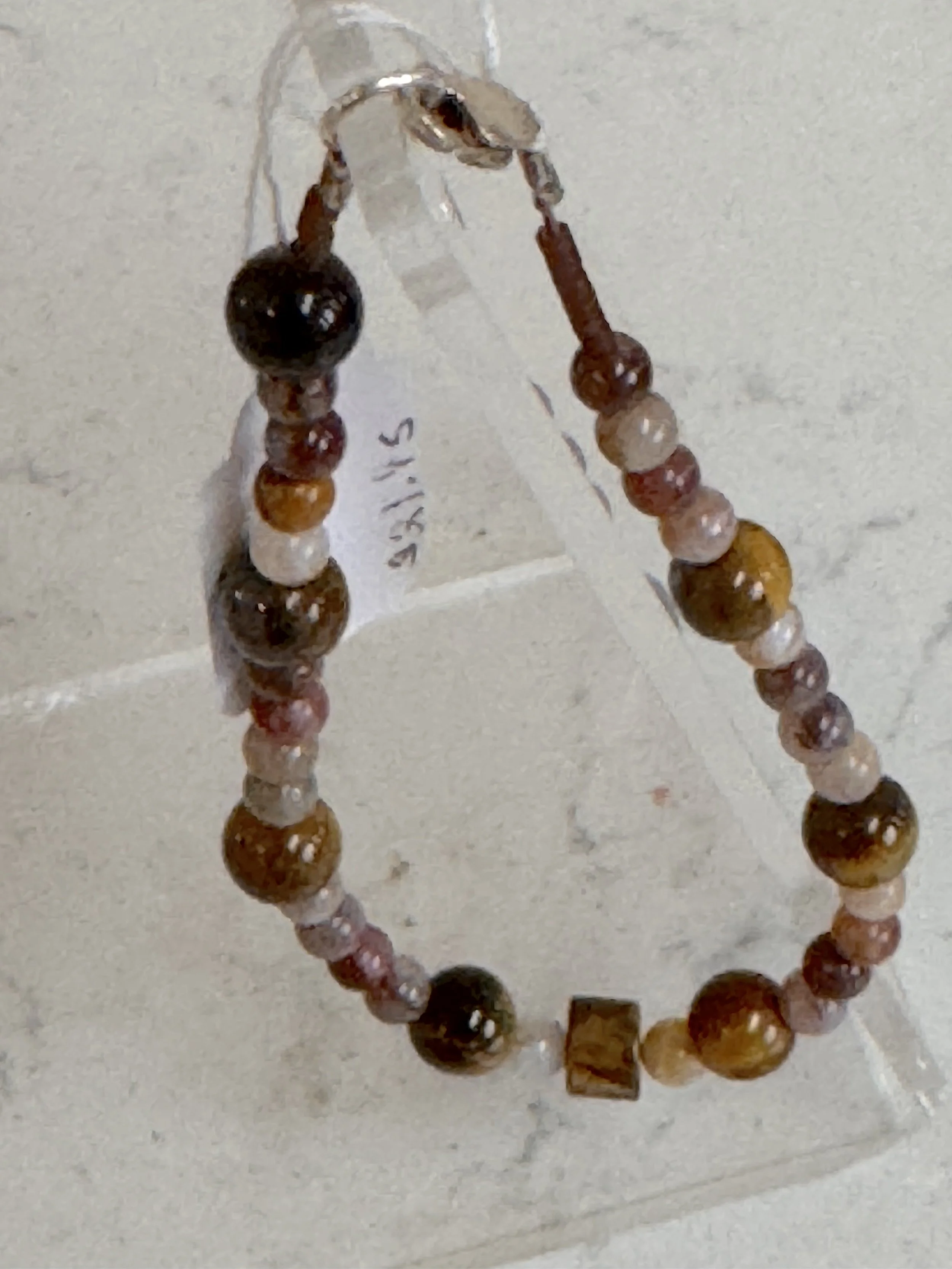 Tigers Eye and Bamboo Agate Brac. on stand.jpeg