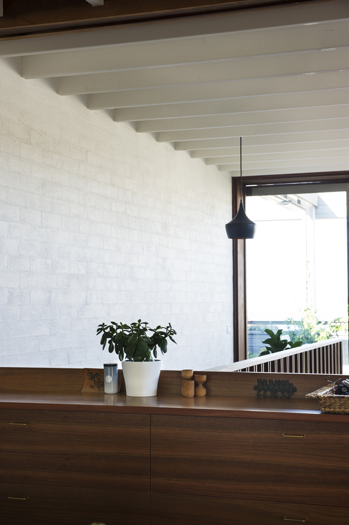 texture - bagged brickwork, spotted gum joinery & windows, exposed painted beams