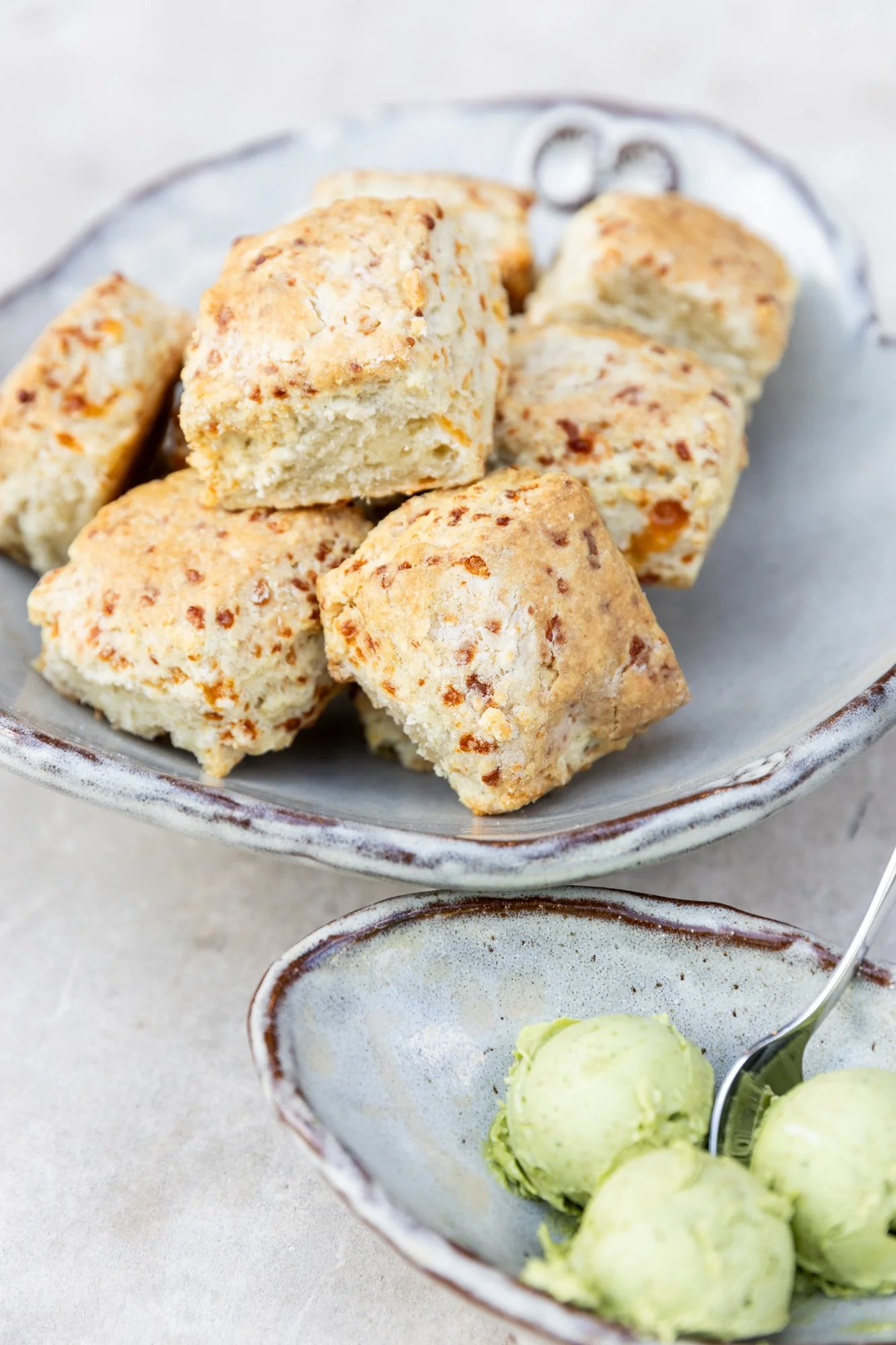 A bowl of cornbread pieces and a small dish of green ice cream Hot and Hot Fish Club Restaurant in Birmingham, Alabama.