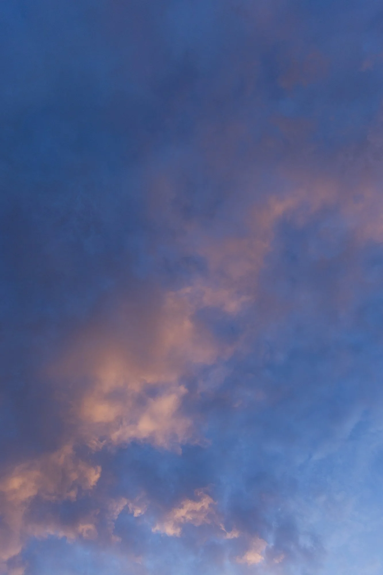 Sky with pink and purple clouds during sunset or sunrise. Ovenbird Restaurant in Birmingham, Alabama.