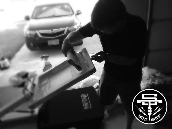 Arlo's friend, Nam, applying the Monsanto silkscreen.