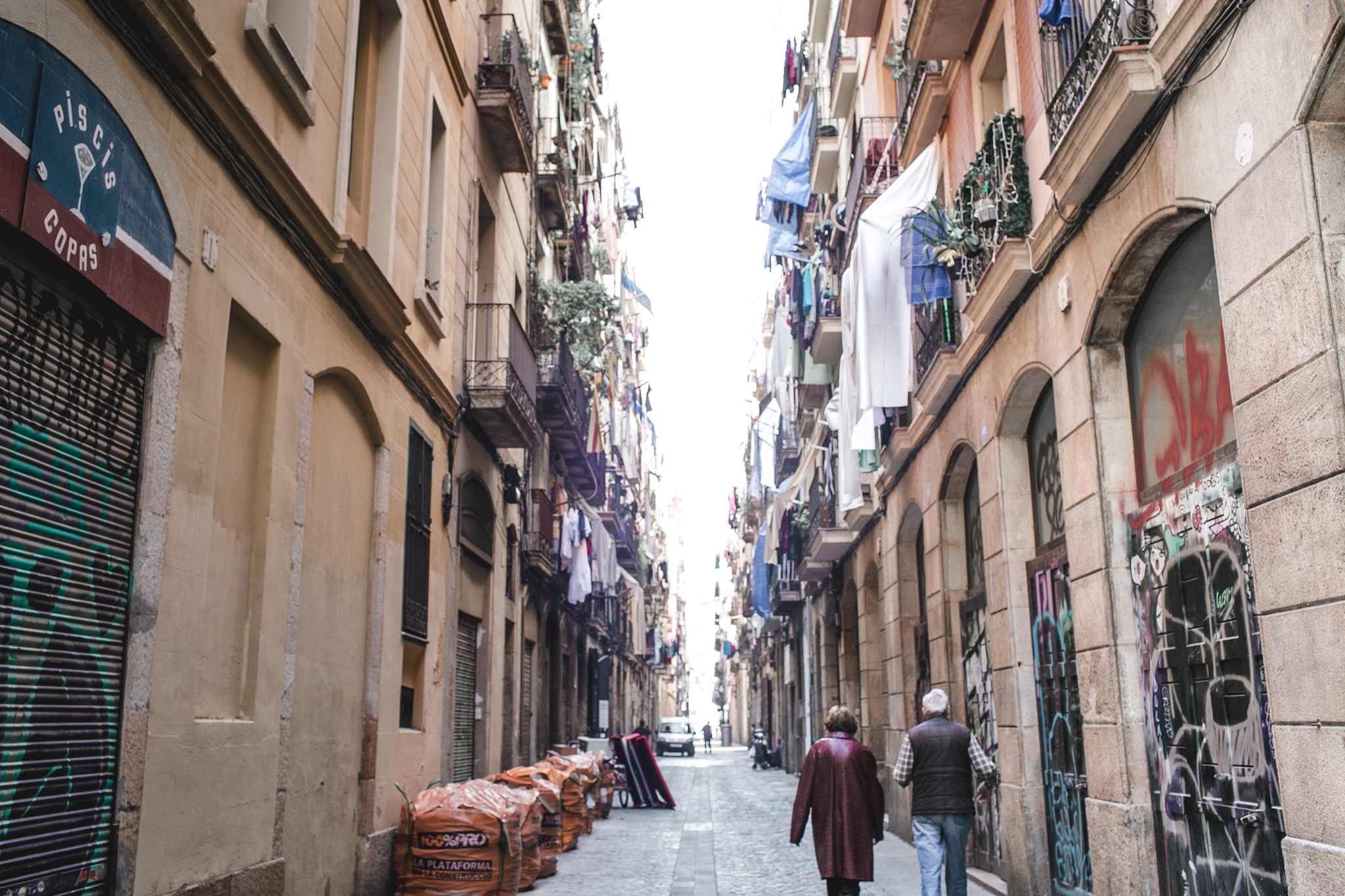 The streets of Raval were doused with graffiti. Laundry hung from every balcony. And typically, these alleys would be full of skateboarders and young hip artists. One of the reasons why we loved this area was because of the lack of tourists. 