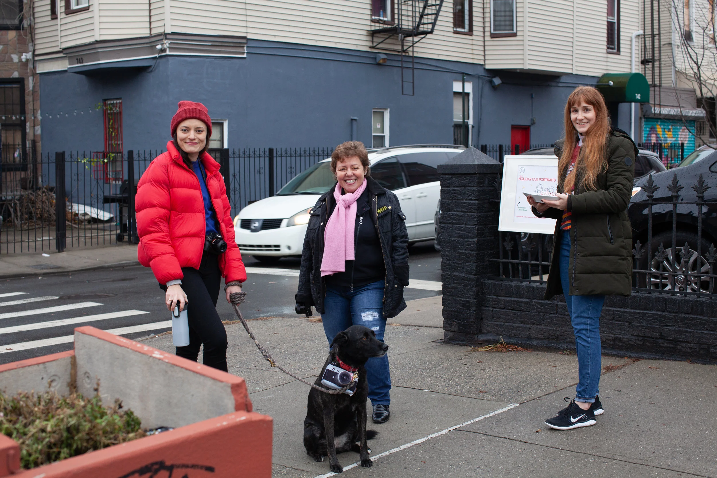 Iris Ebert, Mariana Spirindon, Gloria Cook and Leila spreading a little holiday cheer outside BKC.