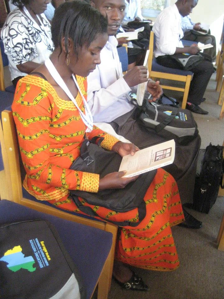 17-Looking over the contents of this year's teacher bag for the EIHR 2014 Rwanda Conference — at Rwanda- Kigali.jpg