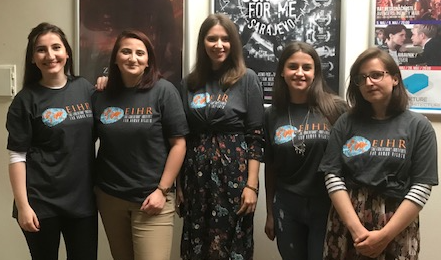 Student interns welcome participants to the film screening