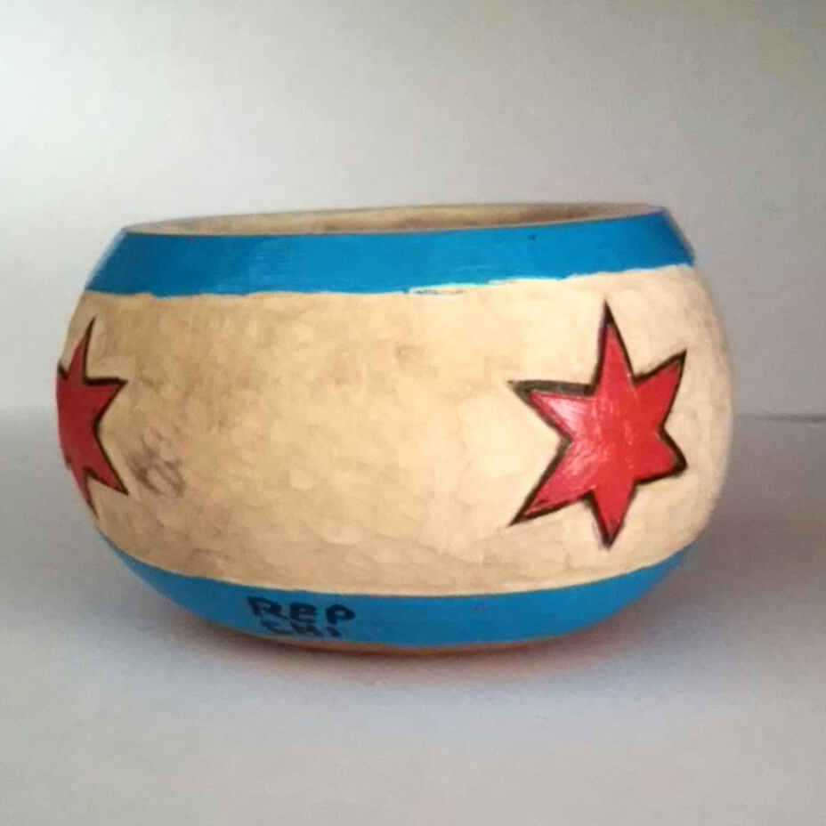 These fantastic Chicago Flag hand painted, hand-carved and pyrographed gourds that will be filled with soy candle wax. 