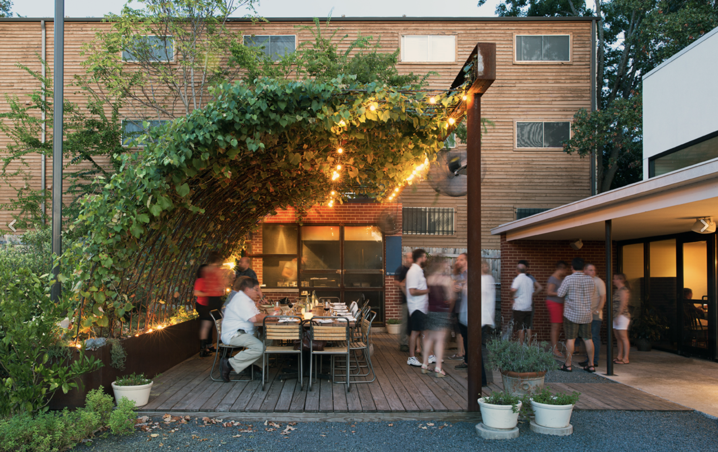 Dai Due Patio

 

 General Contractor. Designed by Kevin Stewart, Architect. Behind the main restaurant a wood deck with diamond trellis above and small brick building houses a La Caja China grill for outdoor cooking and dining. Drophouse custom desi