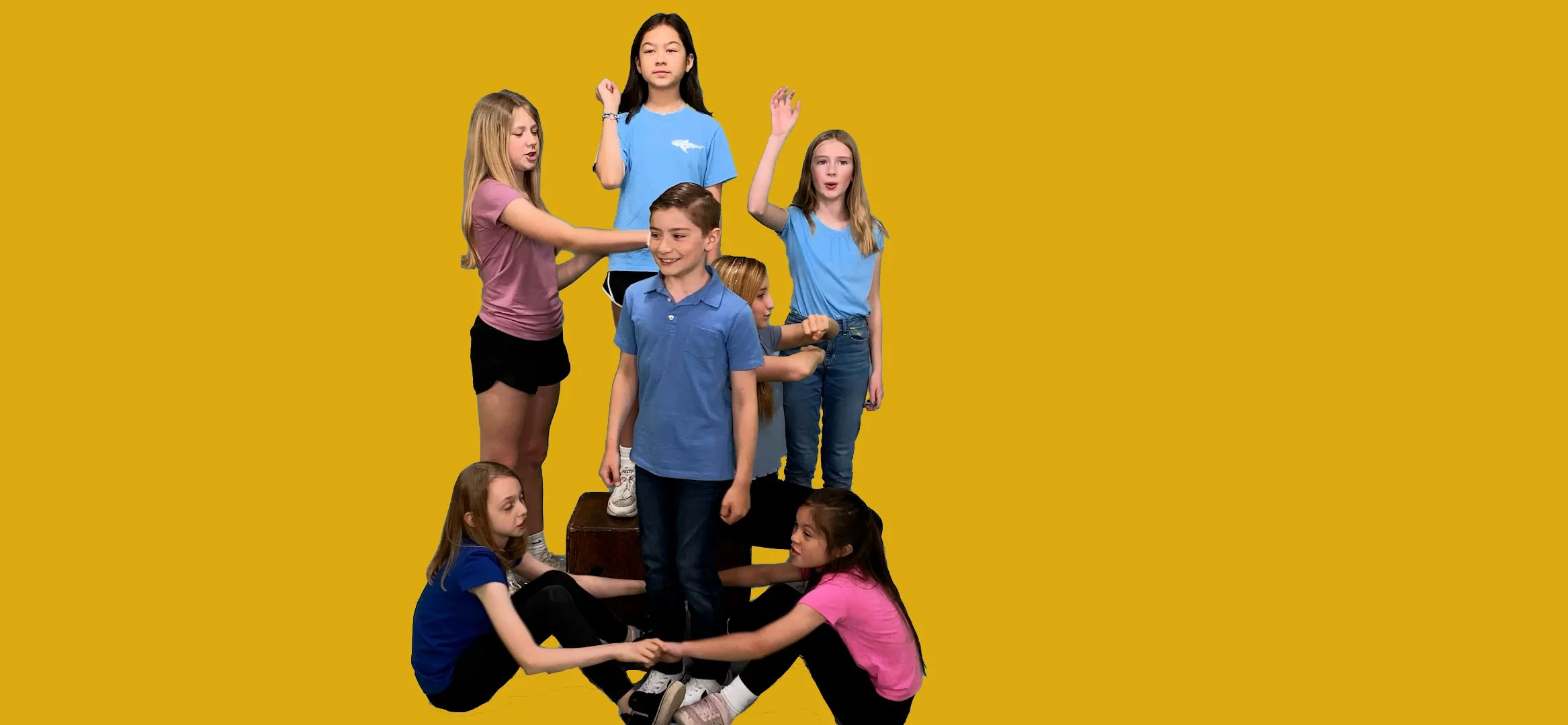 Young people in positions representing a human machine with different parts.