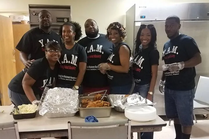 Young Adult Ministry members working in the kitchen.
