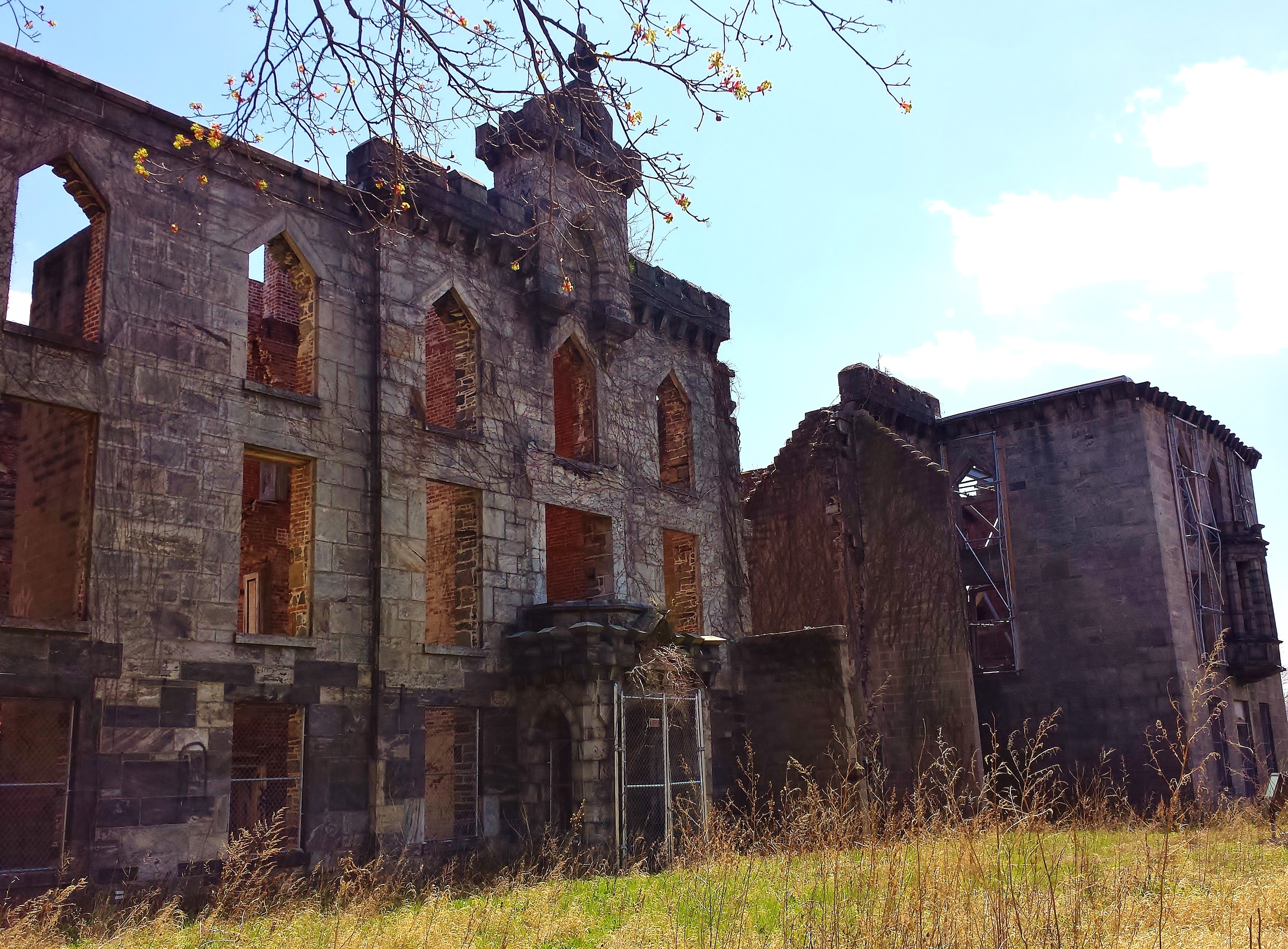 The ruin's exterior walls exist and have been braced with temporary bracing