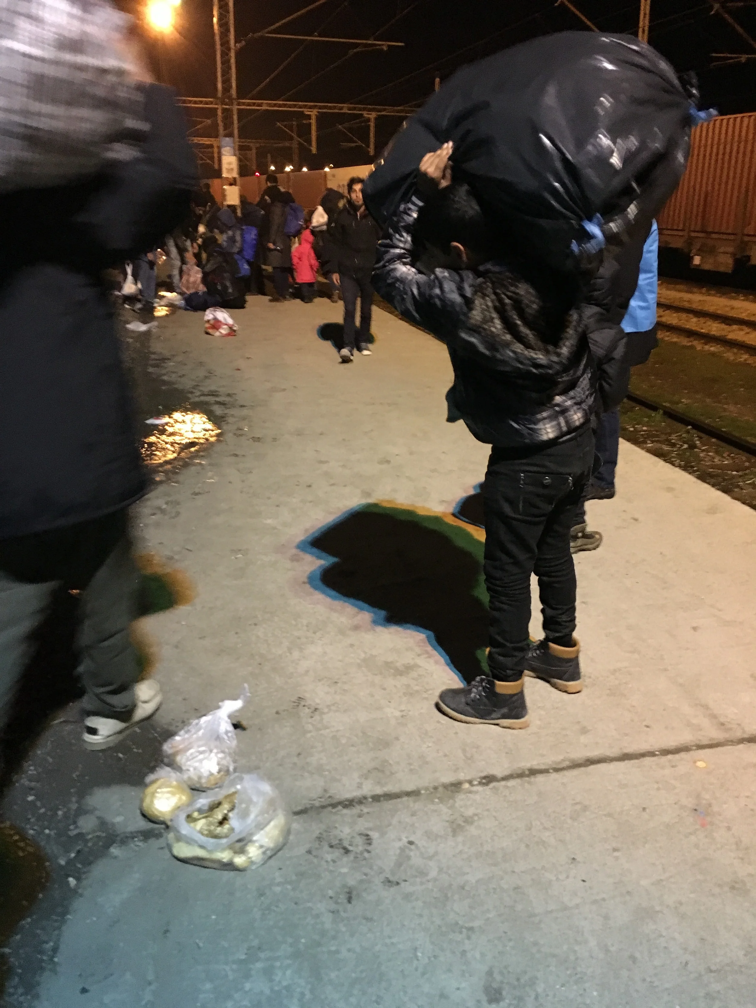 A young boy loading up for his 4-mile walk to the border. 